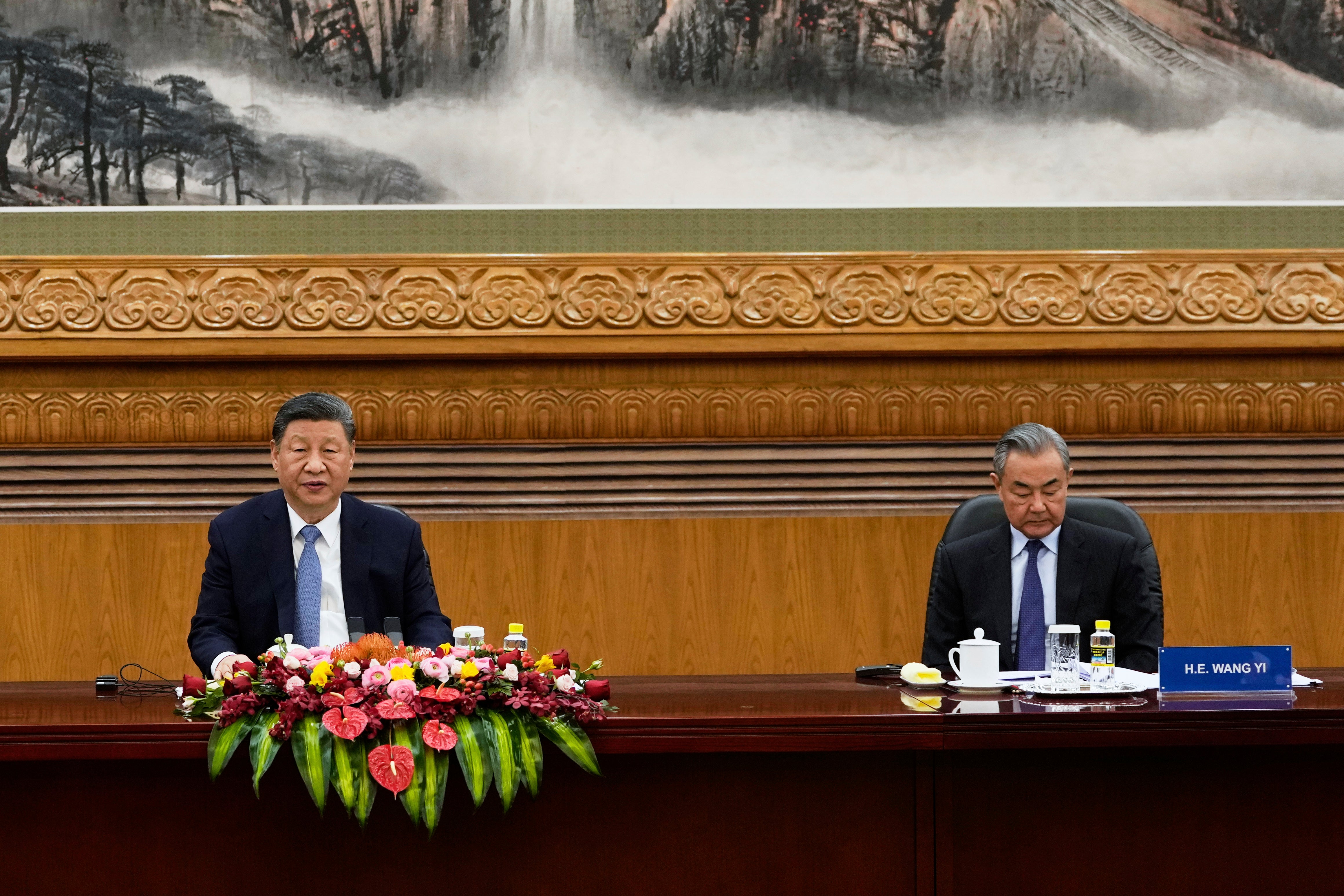 Chinese President Xi Jinping, left, and Foreign Minister Wang Yi