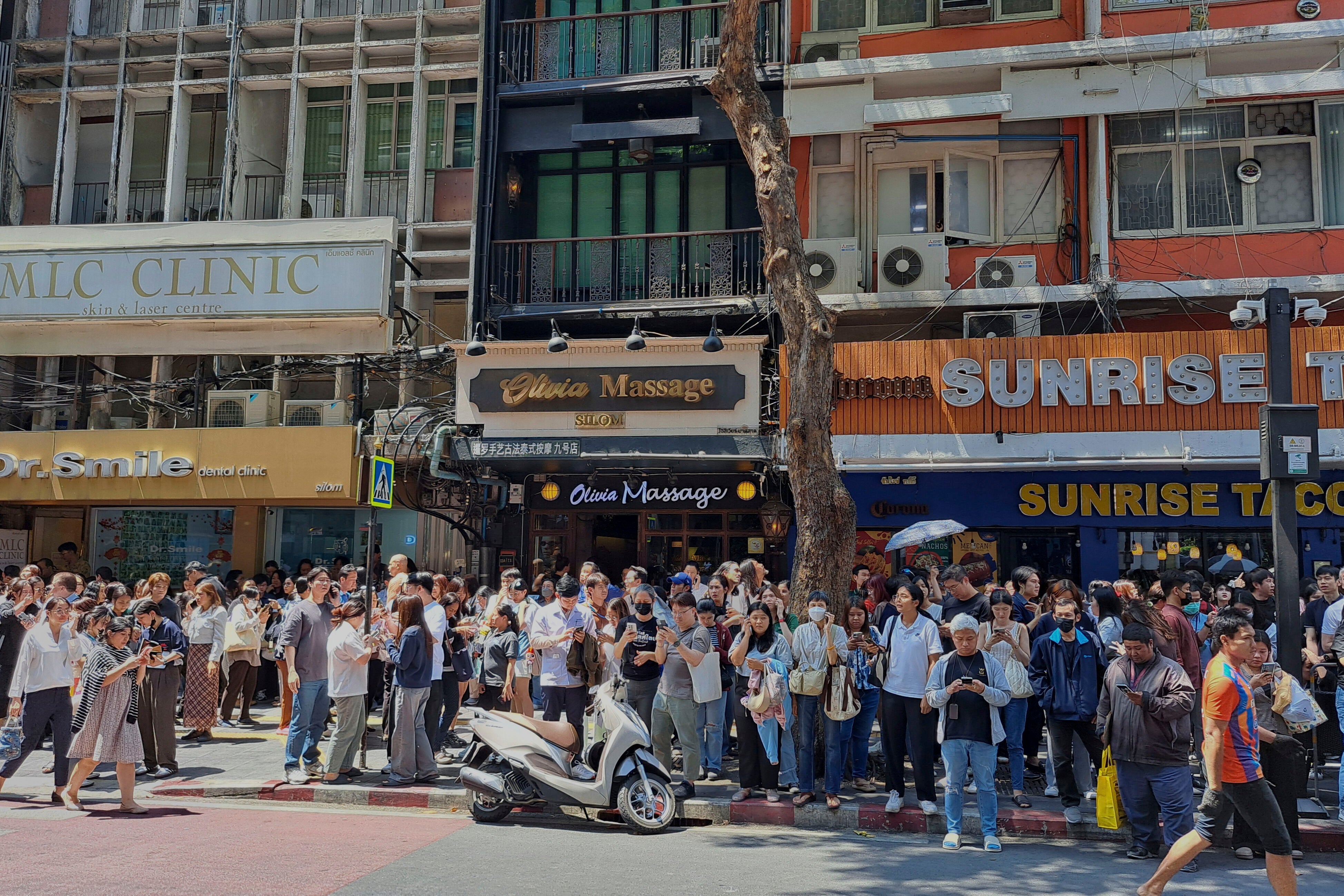 People who evacuated from buildings following earthquake in Bangkok, Thailand