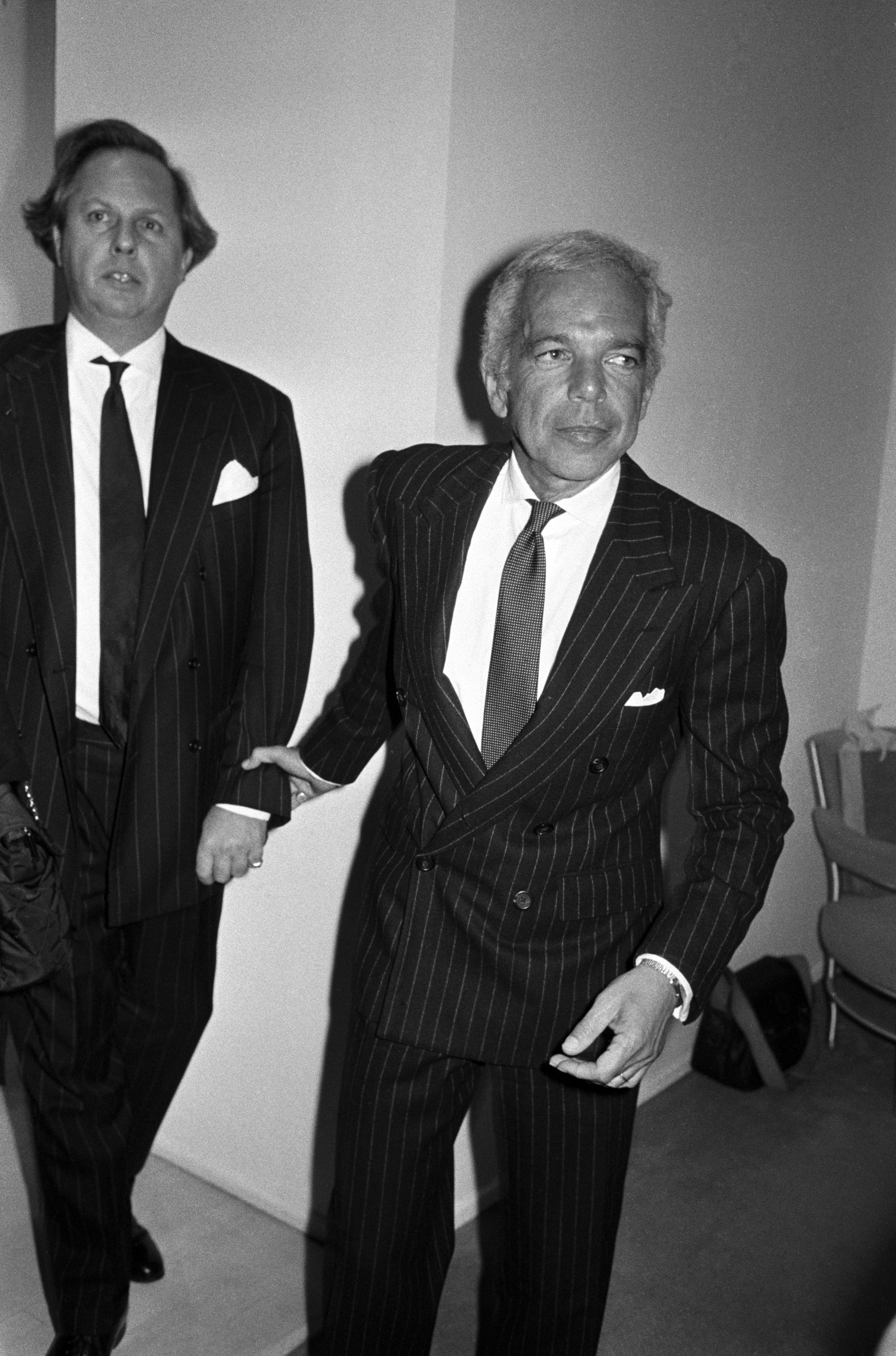 Suited and booted: Graydon Carter pictured with Ralph Lauren in November 1994