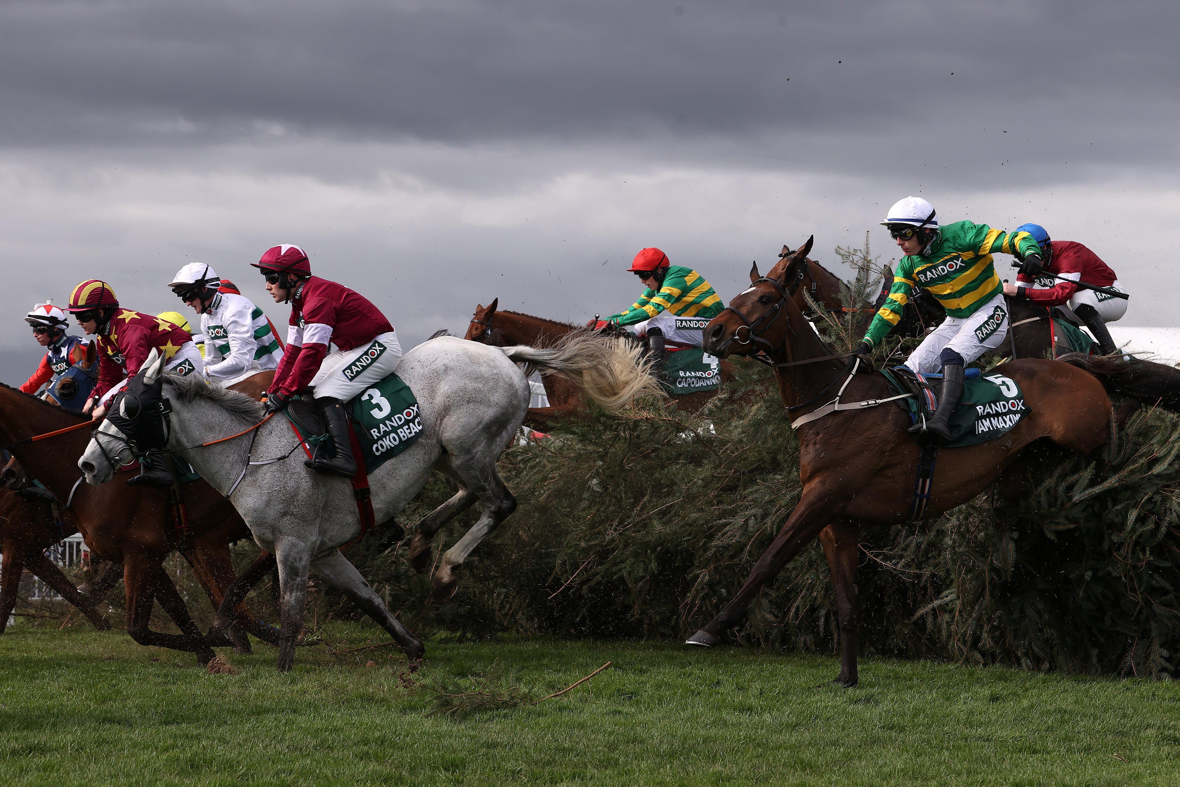 Riders clear The Chair at Aintree Racecourse during the 2024 Grand National