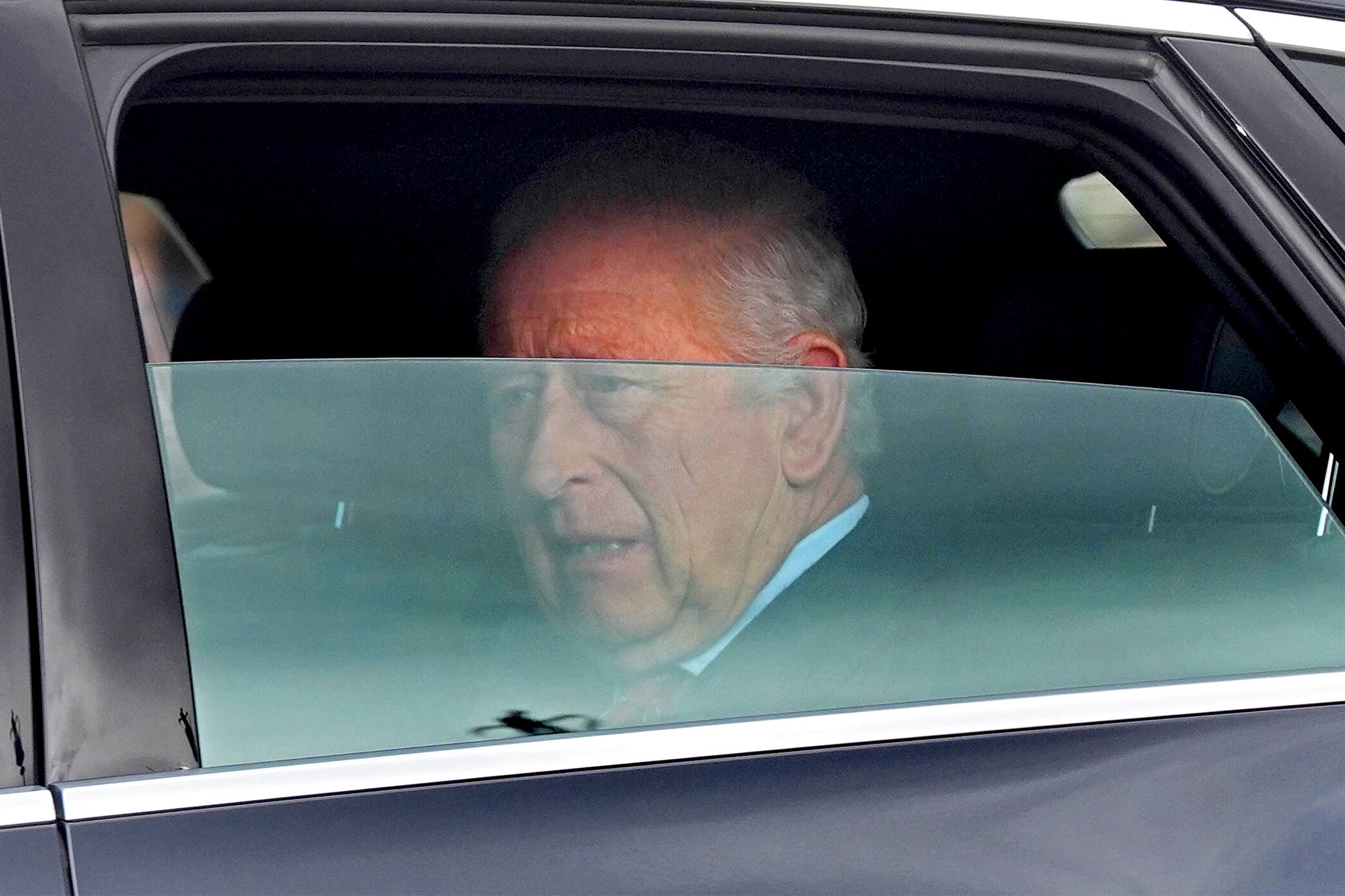 Charles is driven by car from Clarence House, his London home, along The Mall towards Buckingham Palace on Friday morning