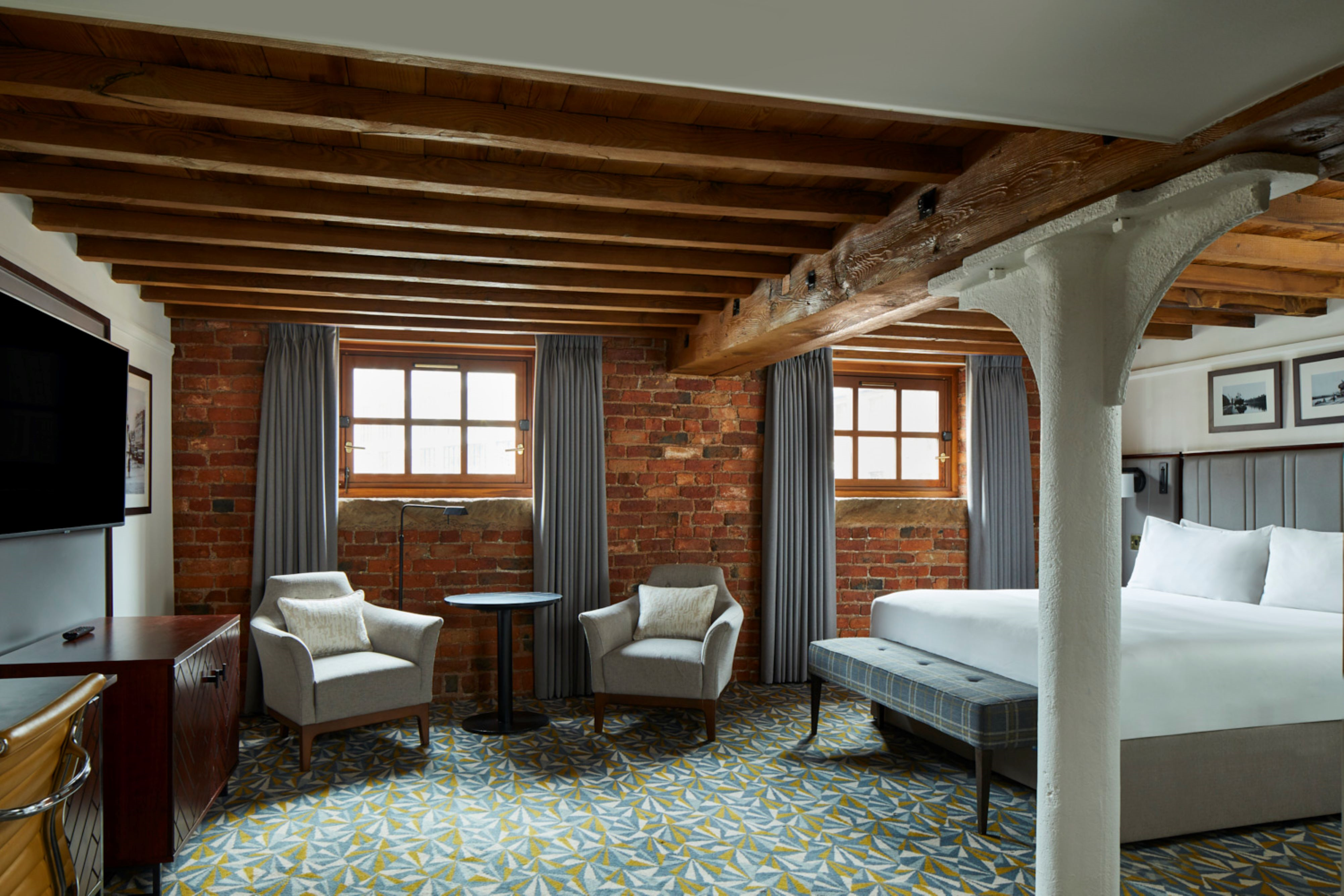 The Marriott Victoria & Albert Hotel shows off its industrial heritage with exposed brick walls and steel beams