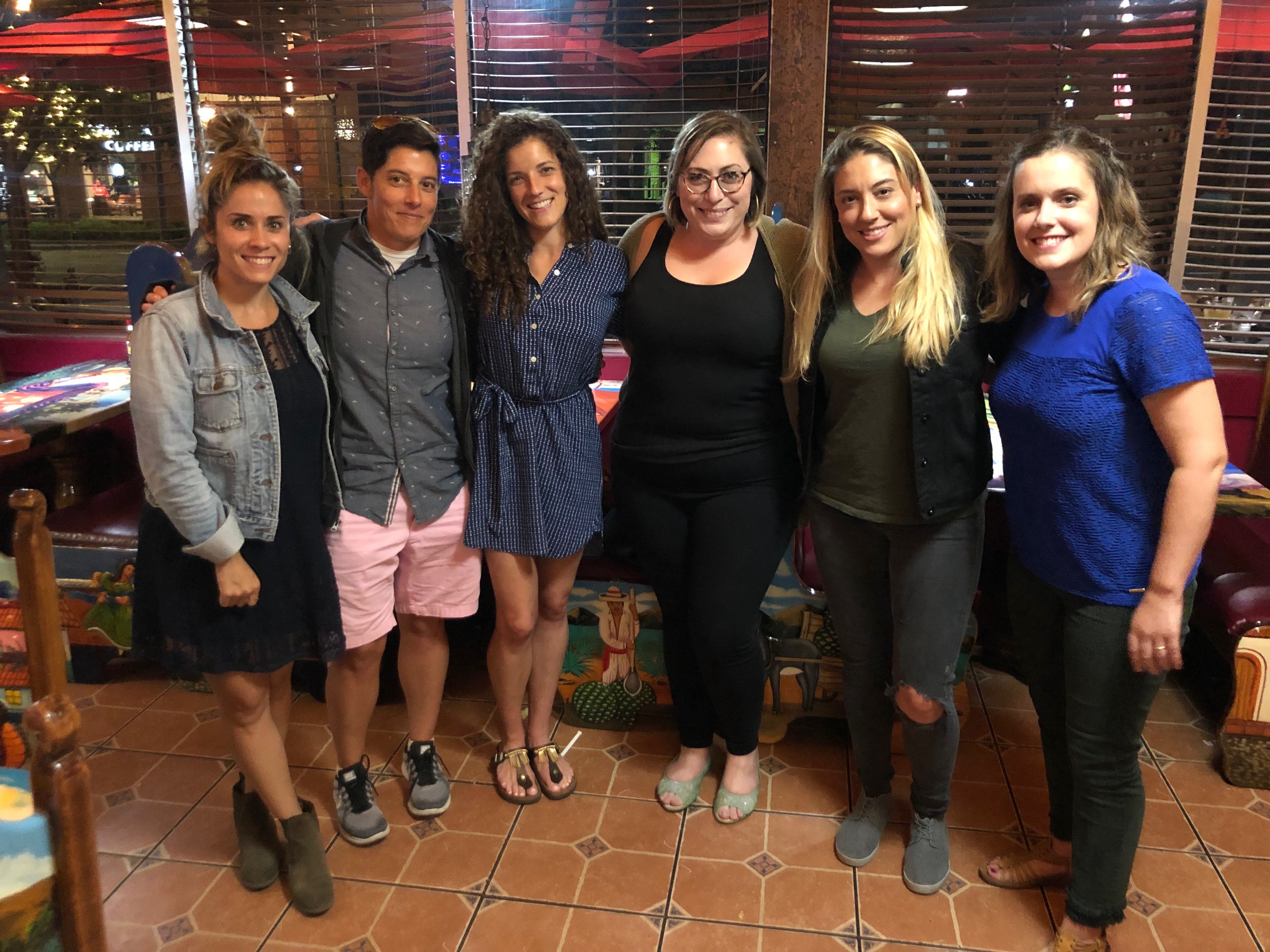 Laura Khalil pictured with five of her step-siblings. Khalil wants to delete her 23andMe data after finding out the company is up for sale after the DNA testing service helped her find nine step-siblings