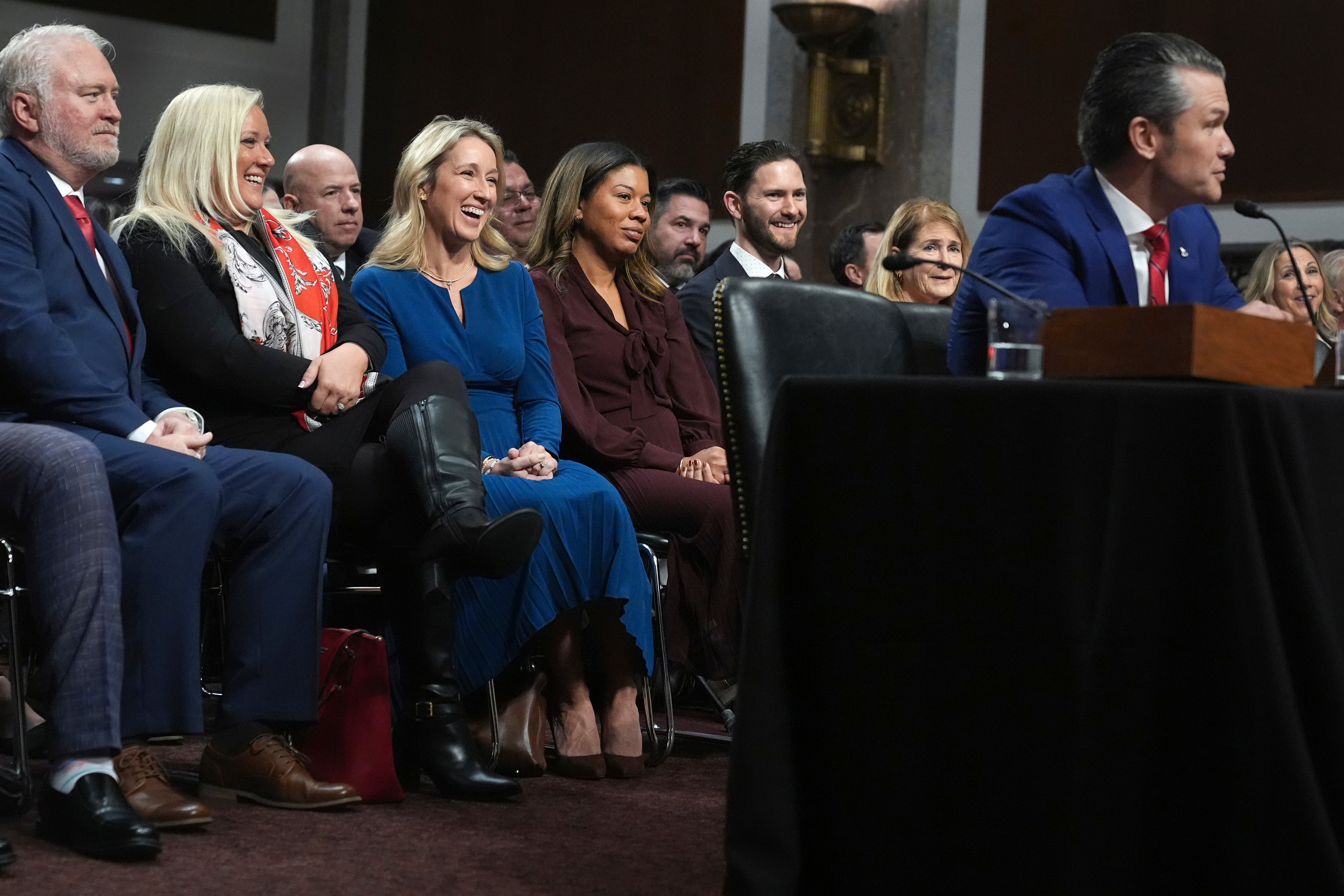 Jennifer Rauchet, third from left, and Phil Hegseth, fifth from left, listen as Pete Hegseth appears before the Senate Armed Services Committee for his confirmation hearing to be Defense Secretary, at the Capitol in Washington, Jan. 14, 2025. (AP Photo/Jacquelyn Martin, File)