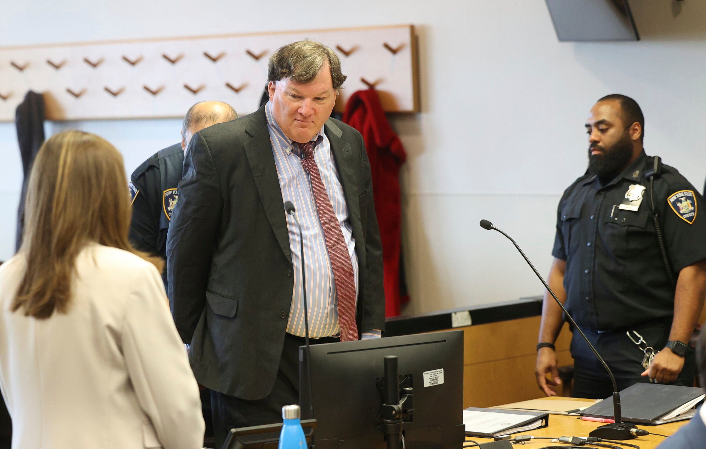 Rex Heuermann, charged in a string of deaths known as the Gilgo Beach killings, appears in Judge Tim Mazzei's courtroom at Suffolk County Court in Riverhead, N.Y., on Friday, March 28, 2025