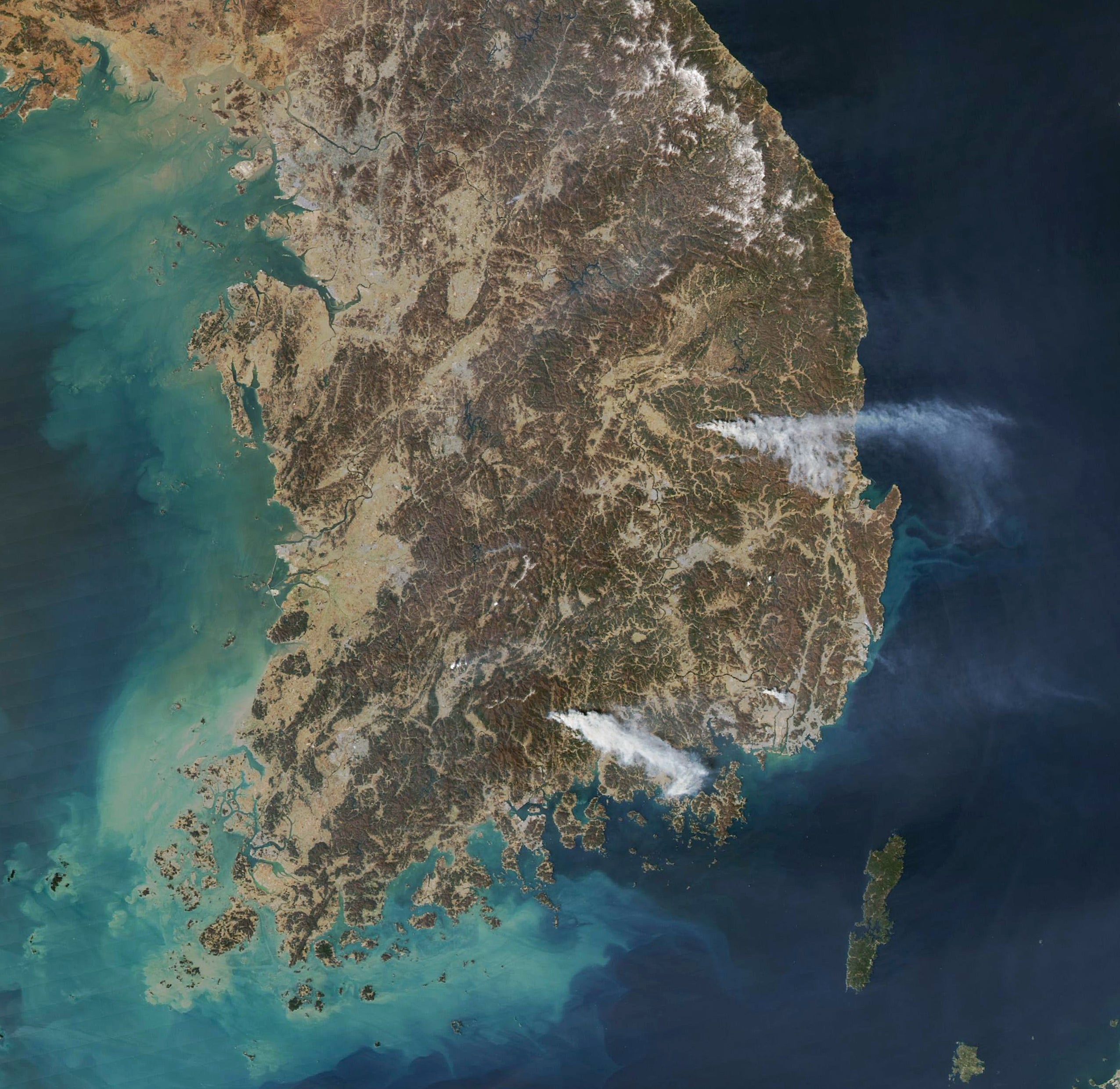 Satellite imagery from Nasa shows smoke rising from two locations in South Korea