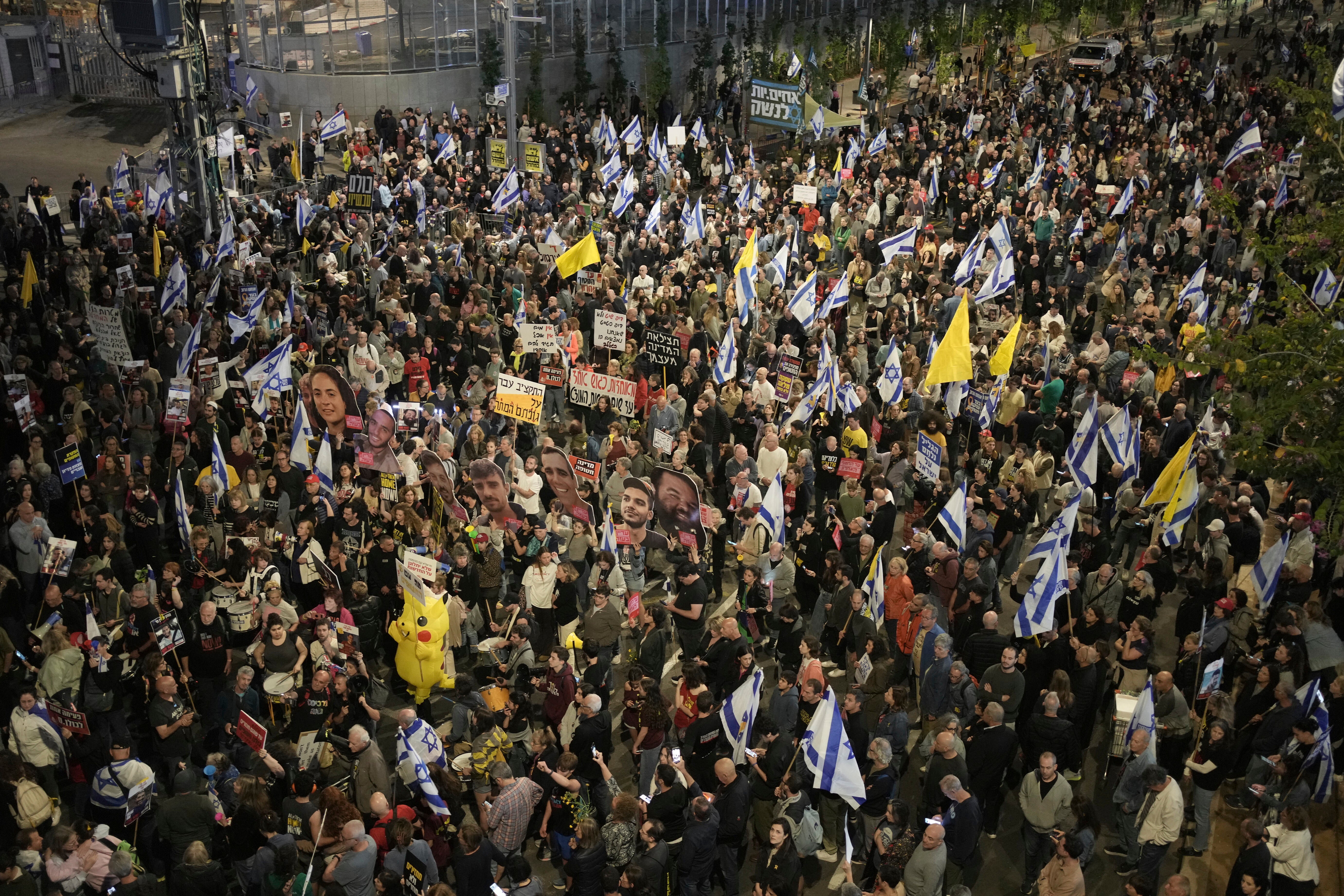 People take part in a protest demanding the immediate release of hostages held by Hamas in the Gaza Strip, in Tel Aviv, Israel, Saturday, March 29, 2025. (AP Photo/Maya Alleruzzo)