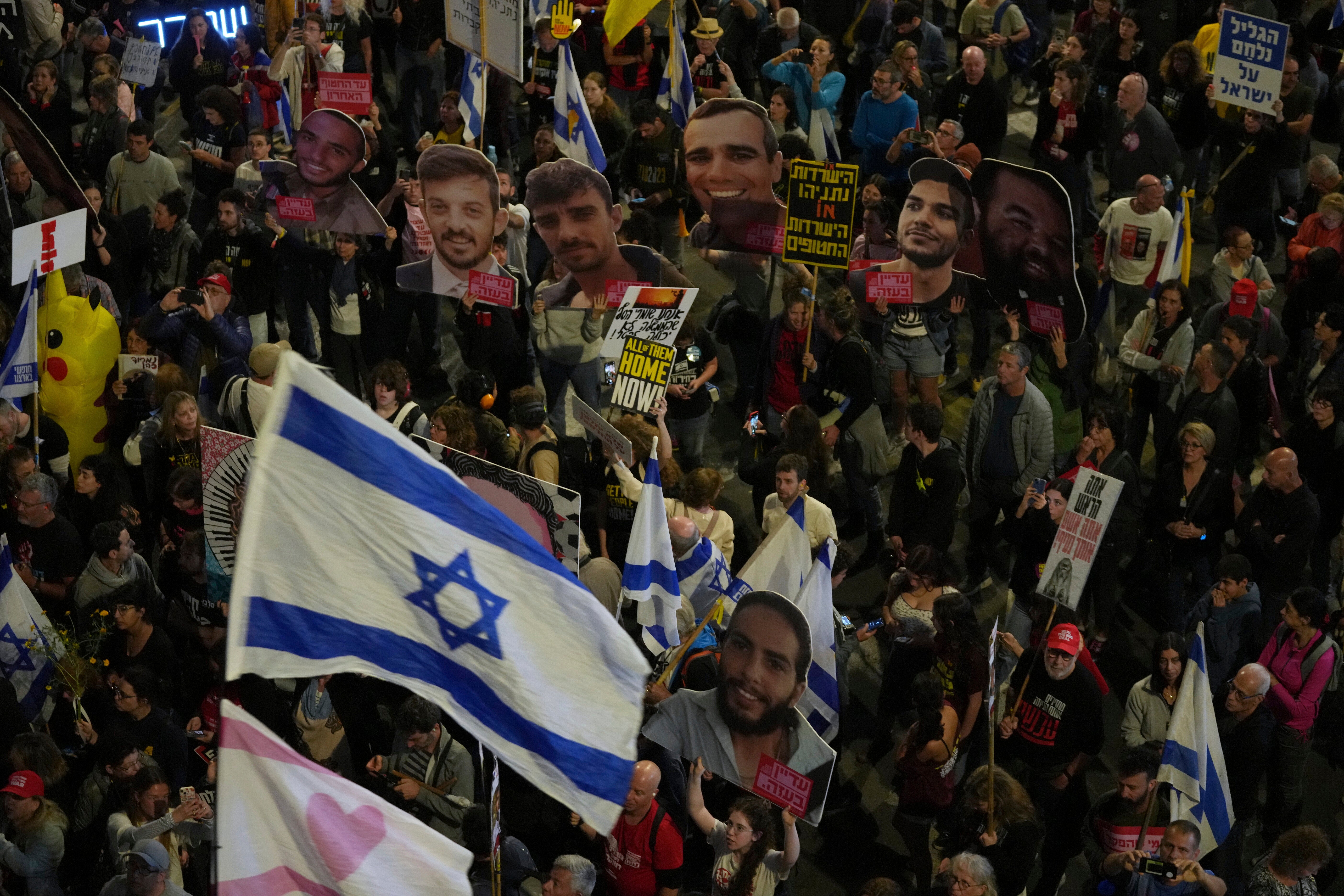 People take part in a protest demanding the immediate release of hostages held by Hamas in the Gaza Strip, in Tel Aviv, Israel, Saturday, March 29, 2025. (AP Photo/Maya Alleruzzo)