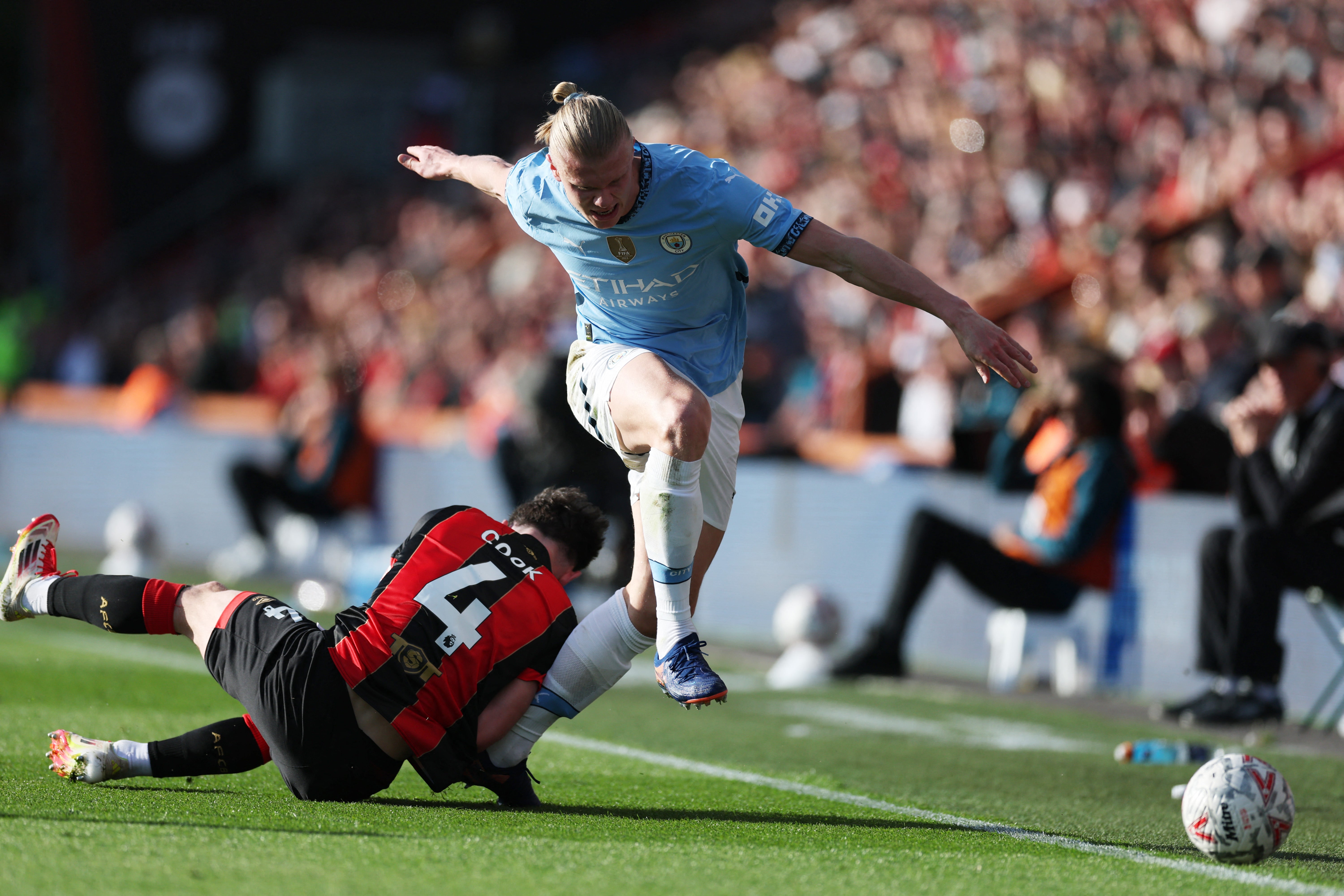 Haaland’s foot was caught under Cook as he ran down the wing