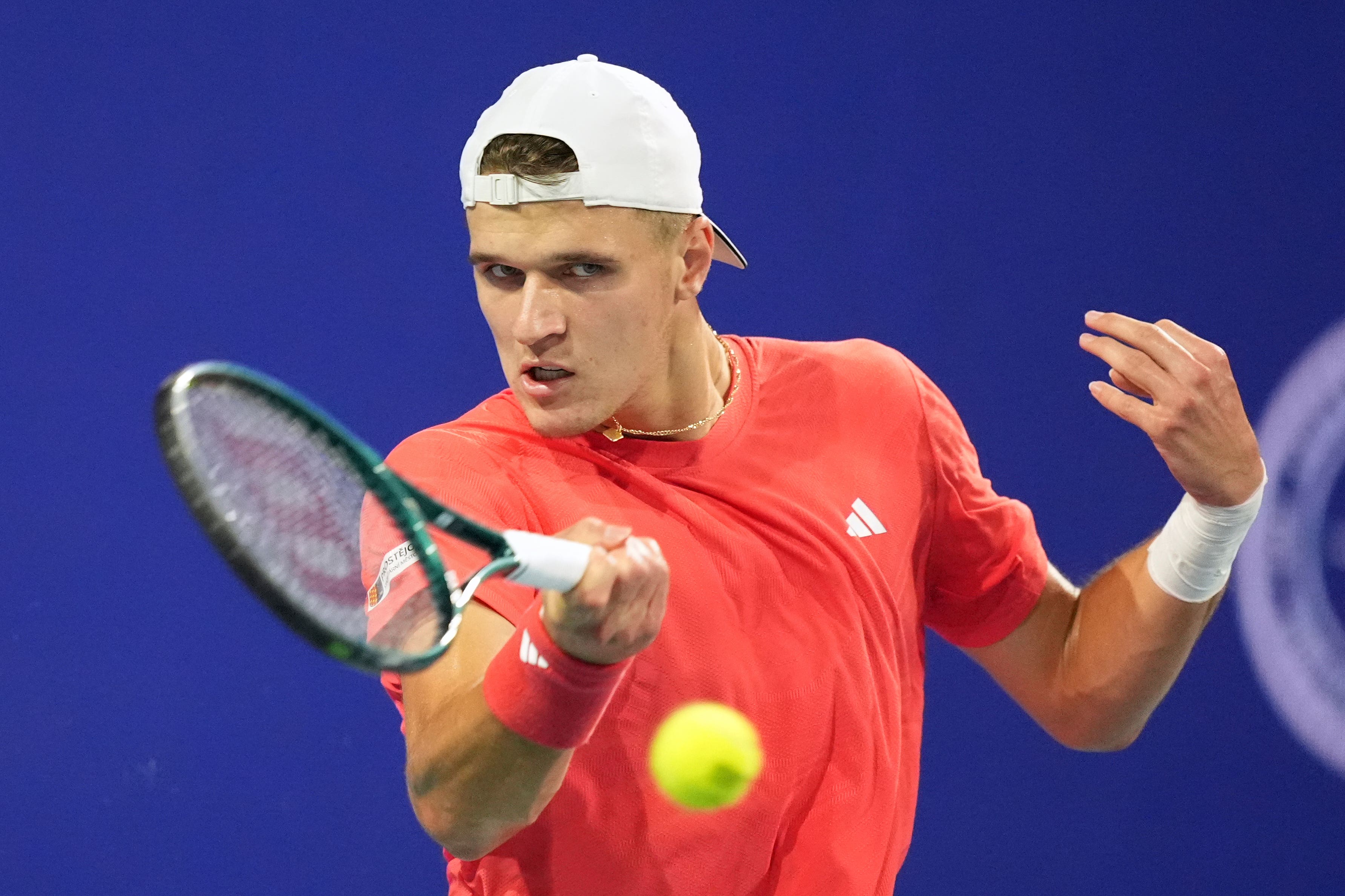 Jakub Mensik plays a shot against Novak Djokovic