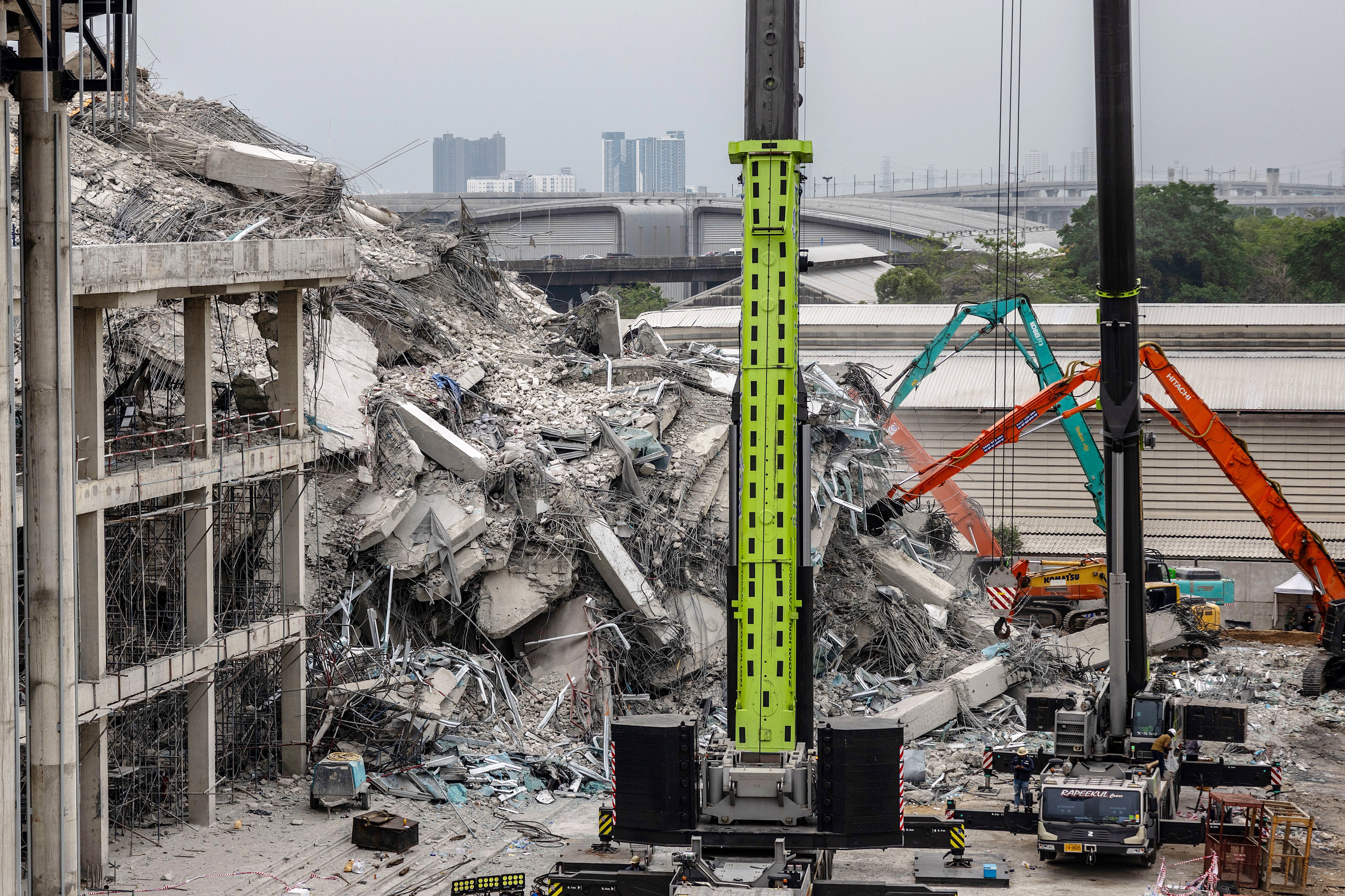 Thai rescue teams speed up their efforts after the 72 hour rescue window passed, at a collapsed construction building on Monday in Bangkok, Thailand