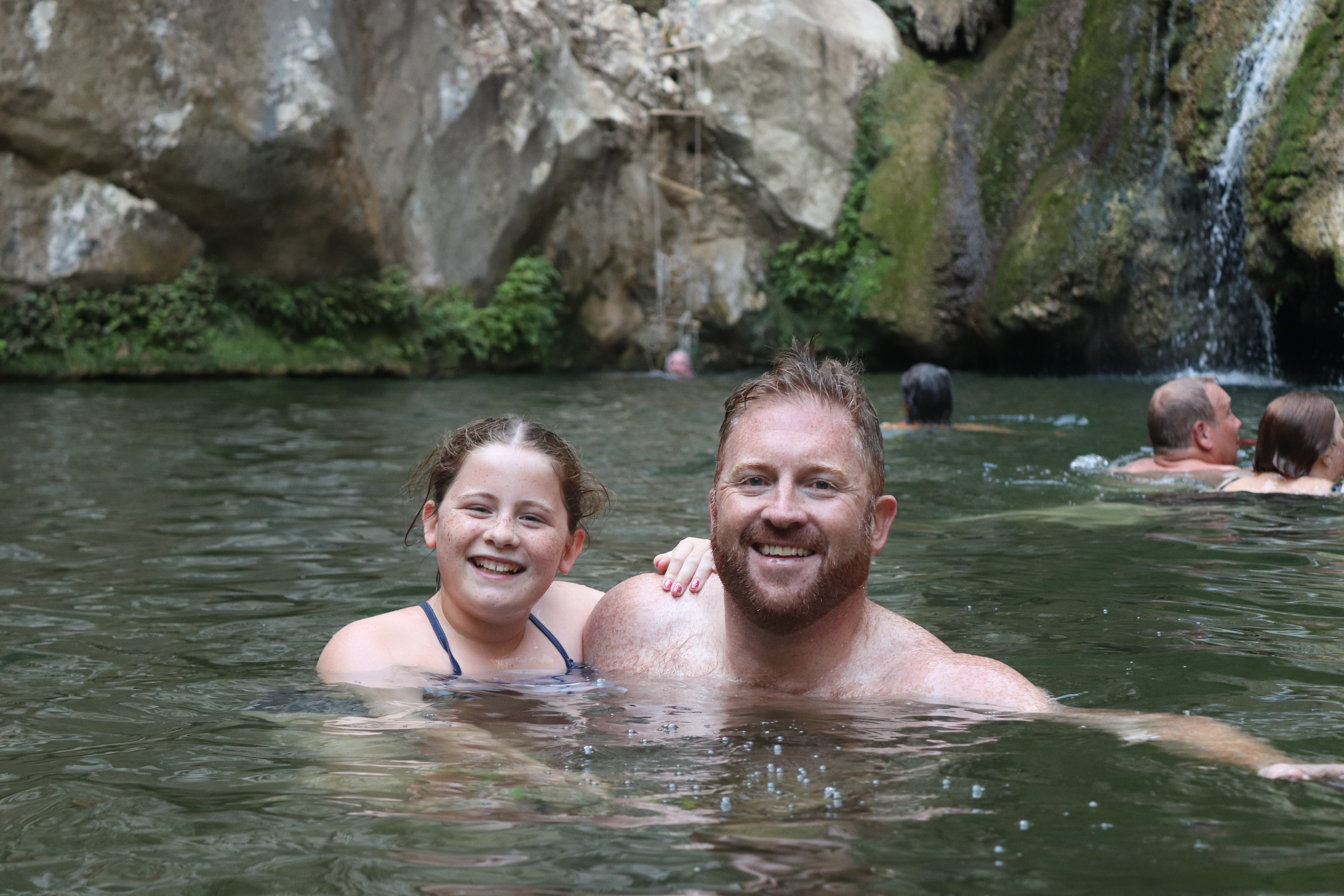 James and Poppy in the freshwater lake at the Polilimnio Waterfalls