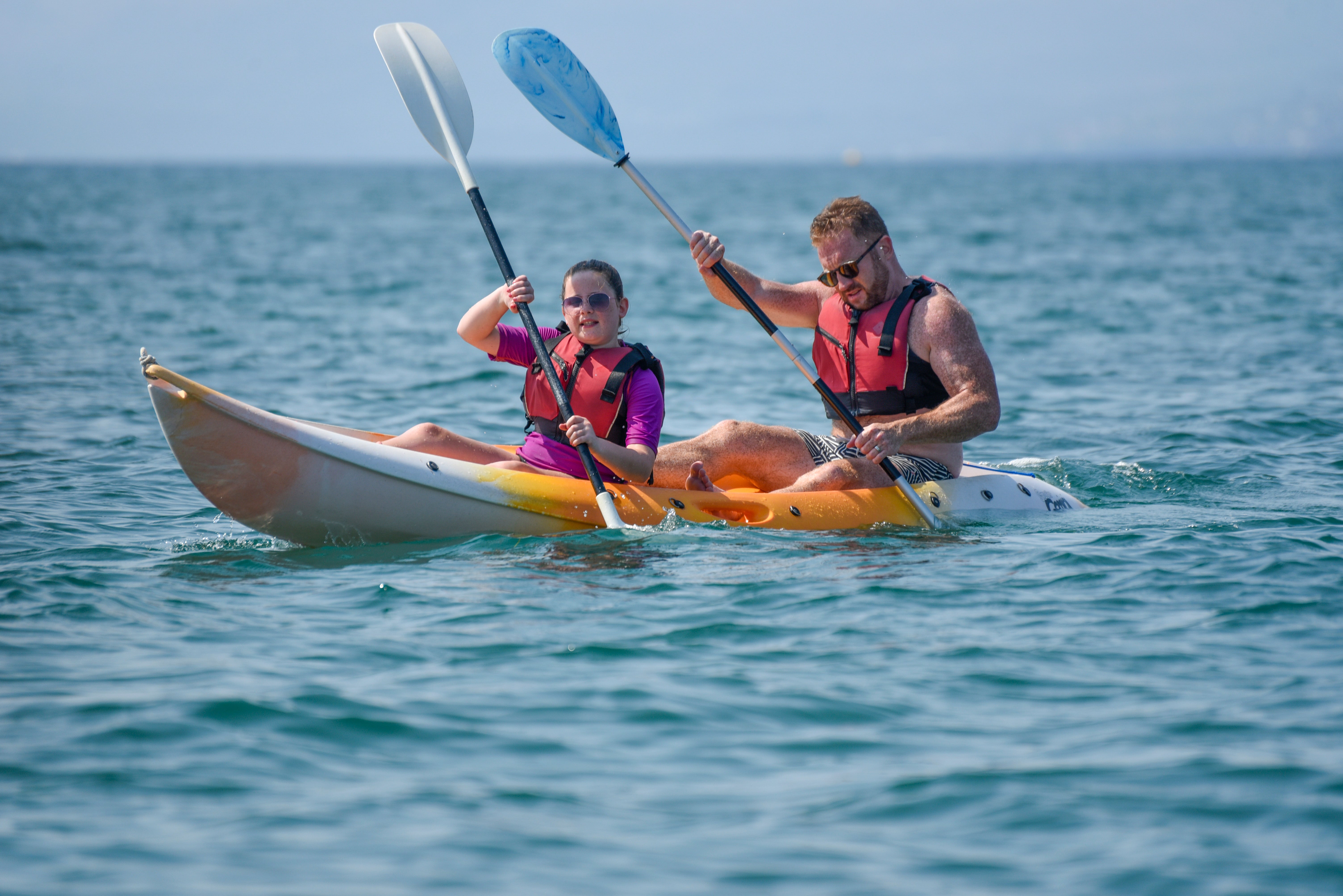 James and Poppy kayaking in the sea