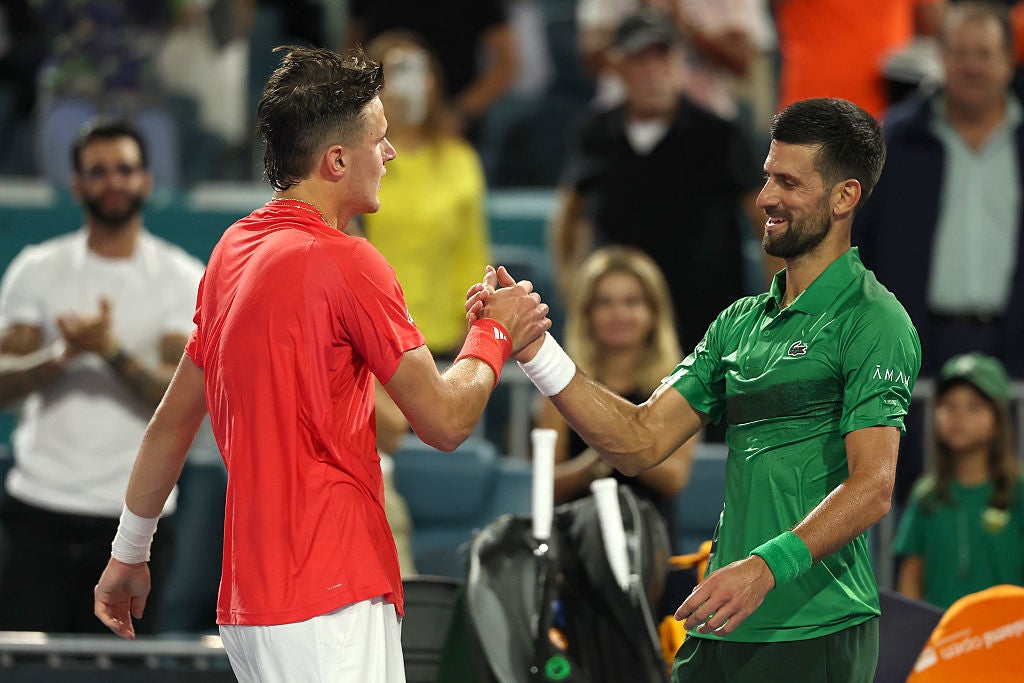 Mensik, left, pays credit to Djokovic's influence in his victory speech