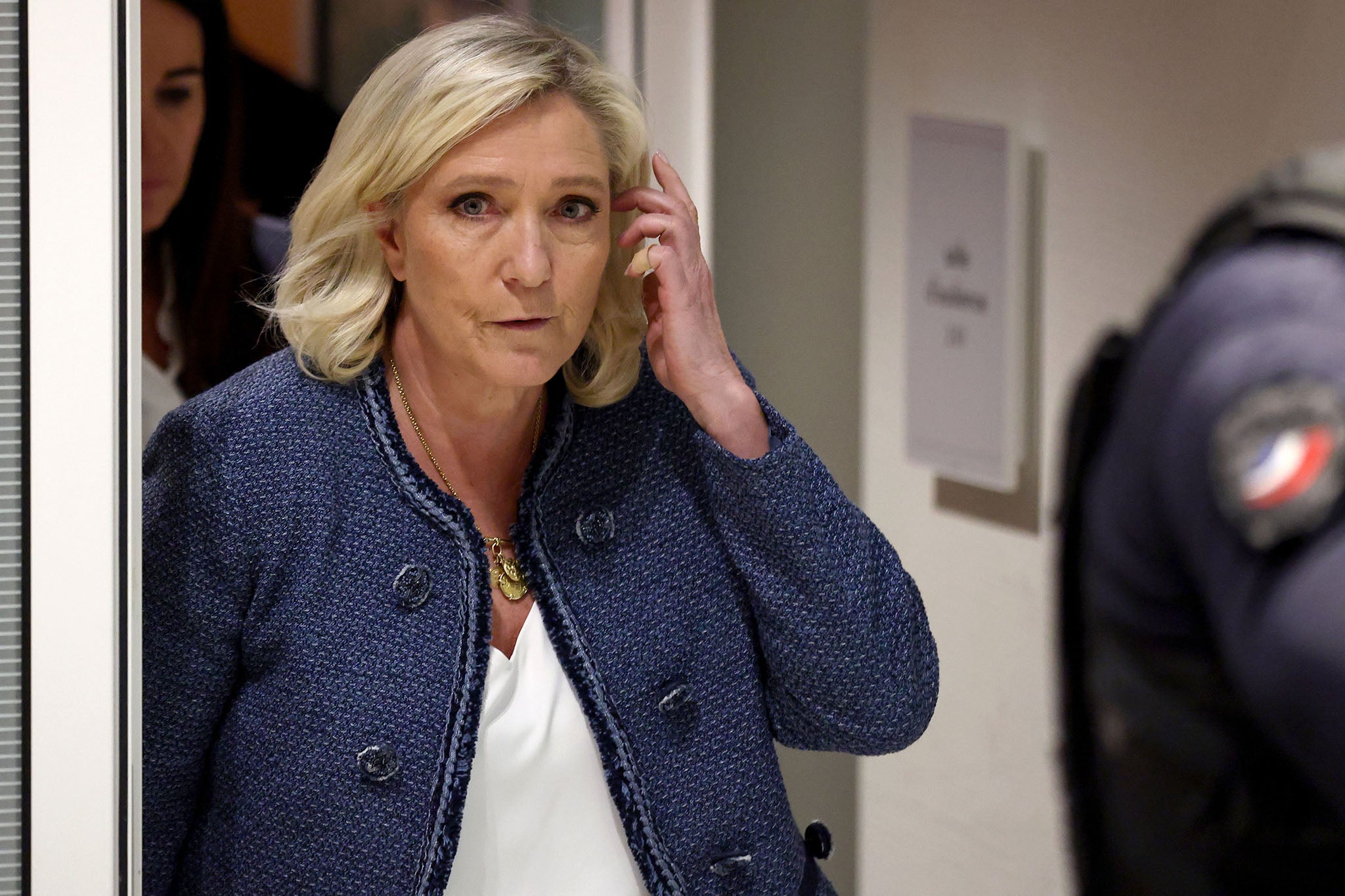 Marine Le Pen leaves the courtroom after her guilty verdict