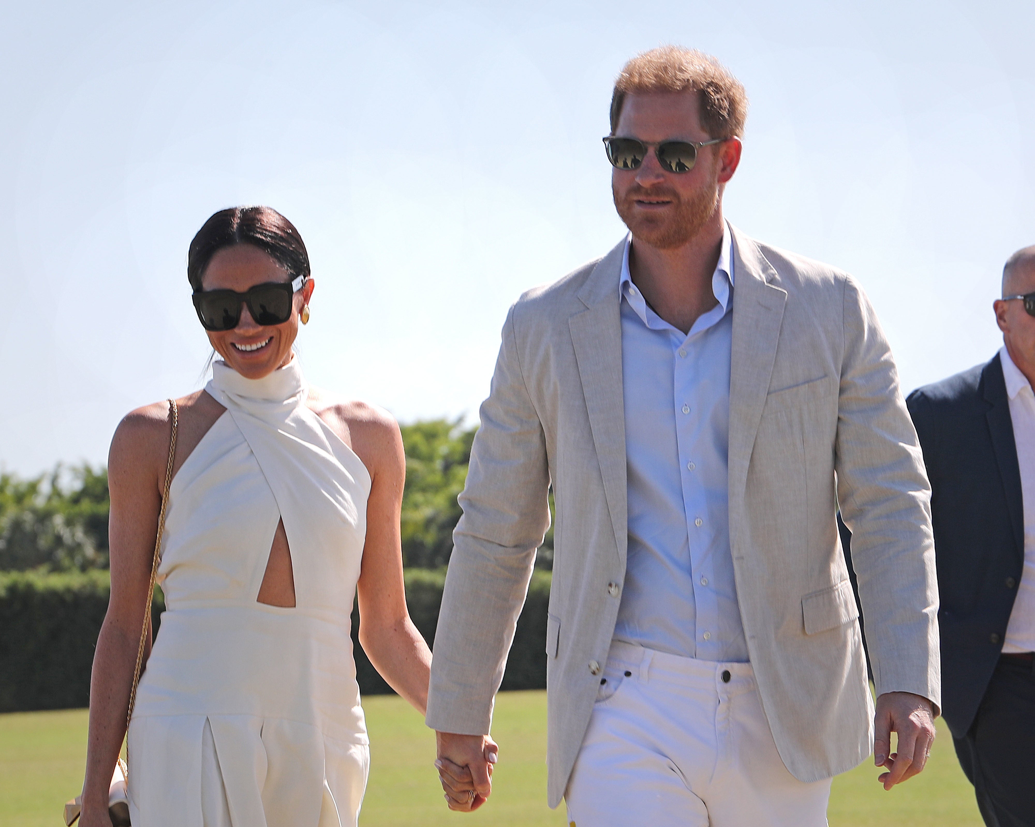 Meghan and Harry attending a fundraising polo match for Sentebale in Miami last year