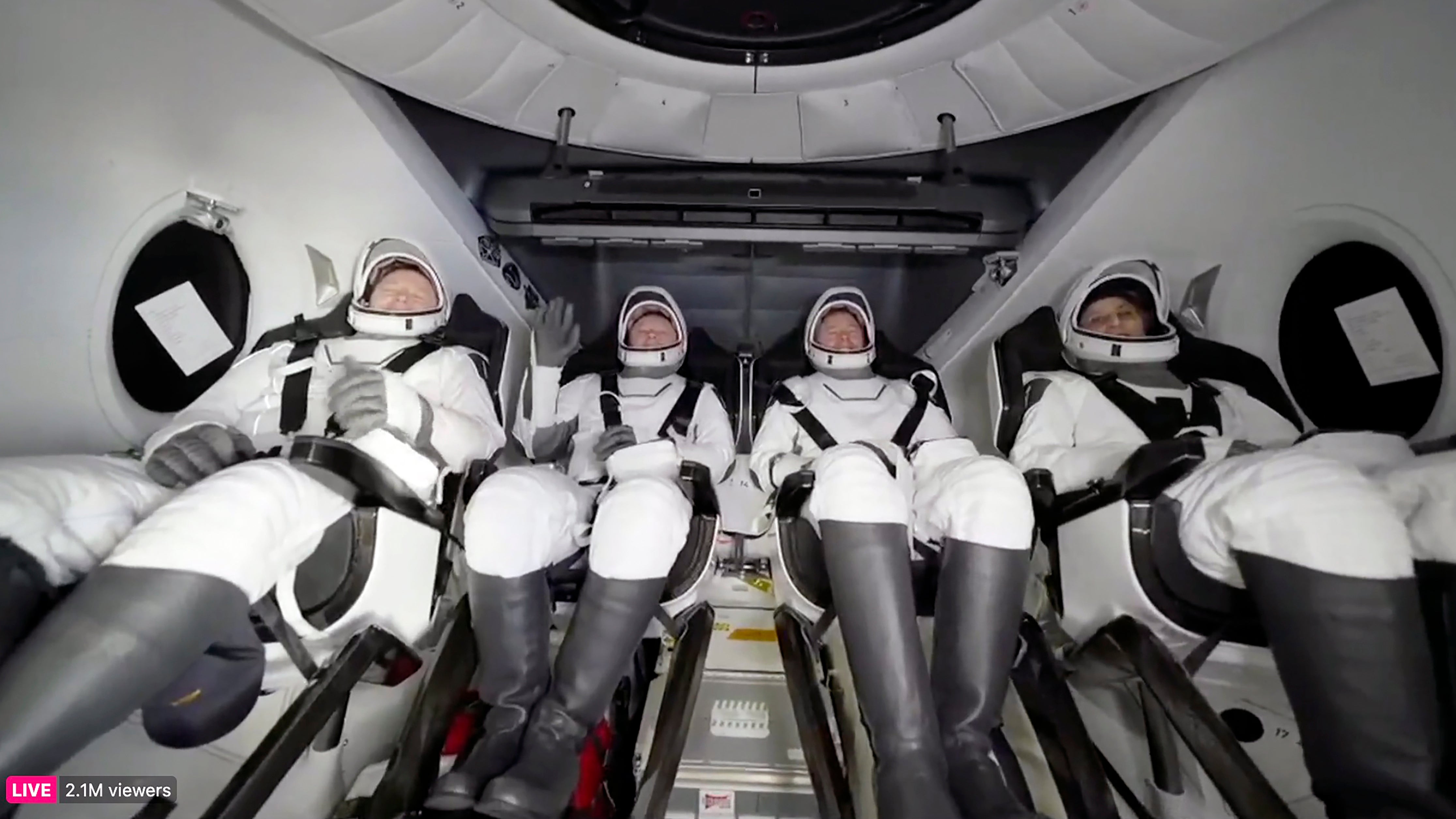 NASA's Butch Wilmore, Russia's Alexander Gorbunov, NASA's Nick Hague, and NASA's Suni Williams (left to right) wait to exit the SpaceX capsule after splashing down on March 18