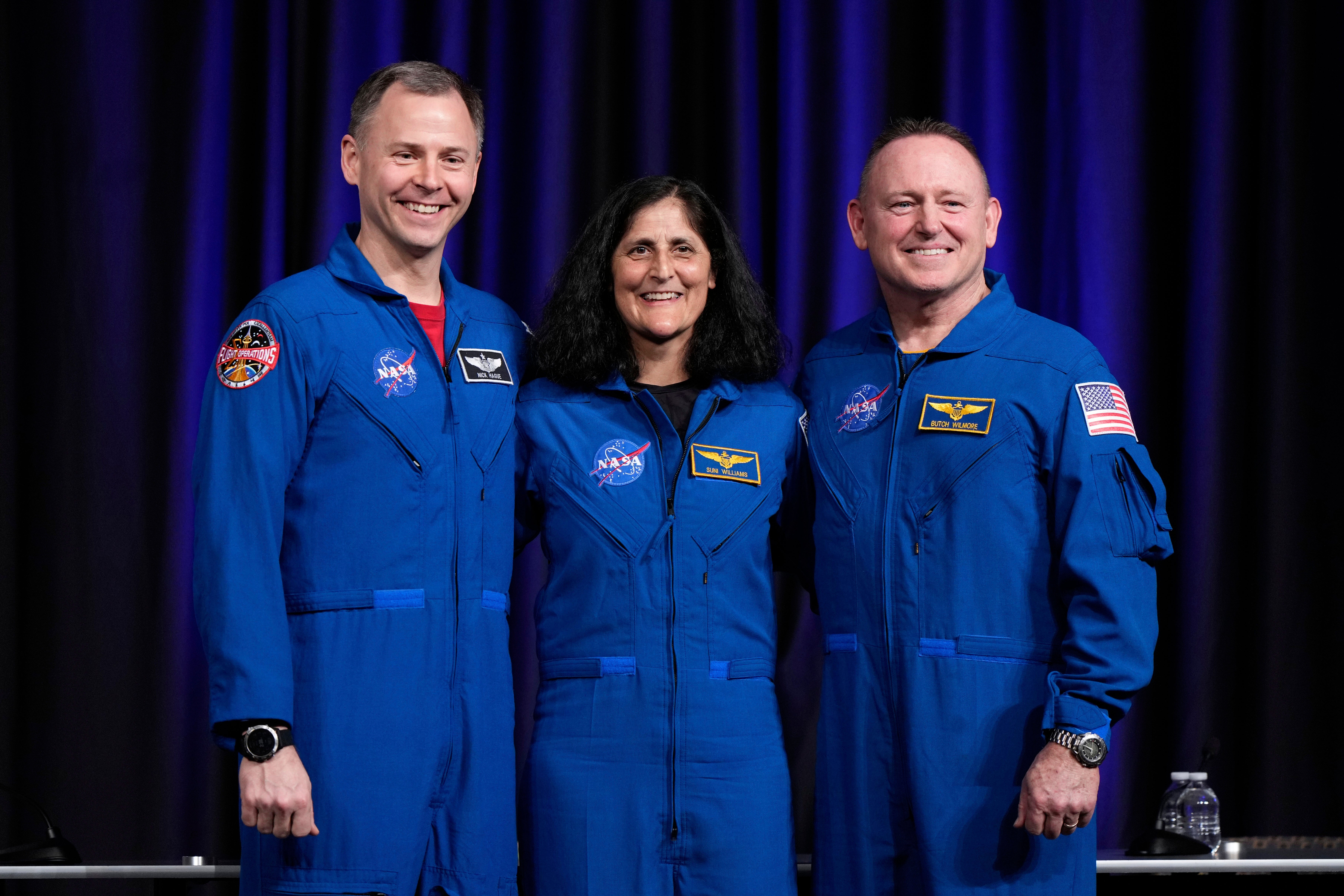 Astronauts Nick Hague (left), Suni Williams (center) and Butch Wilmore (right) speak at a press conference at Johnson Space Center. On March 18, Williams and Wilmore returned from an unexpected nine-month stay in space