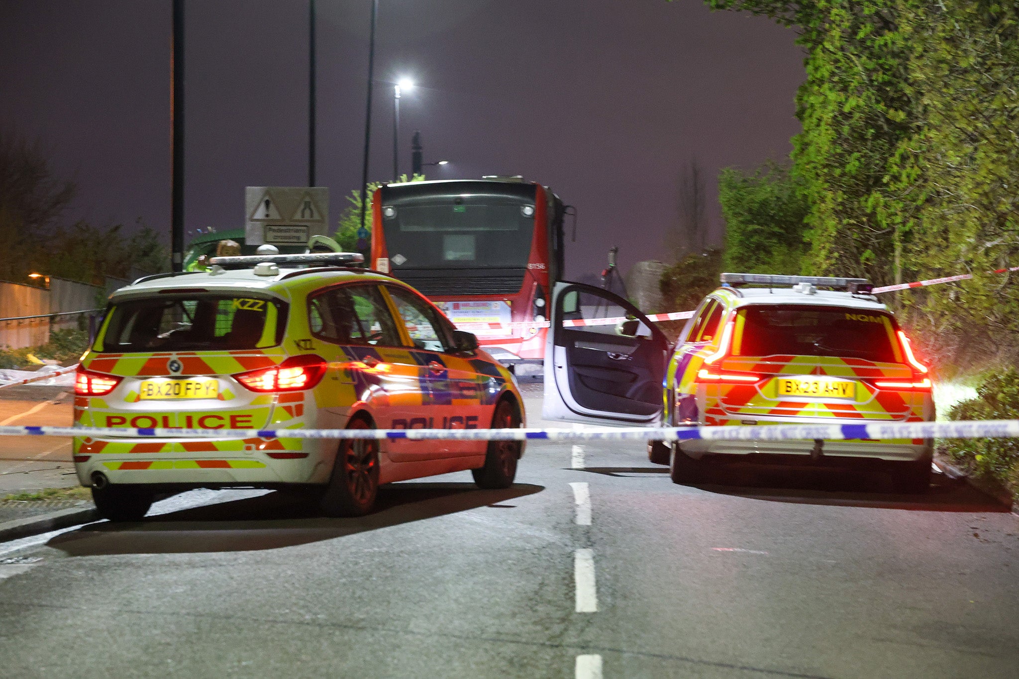 Police attend the crash involving a bus and car, with three people pronounced dead at the scene