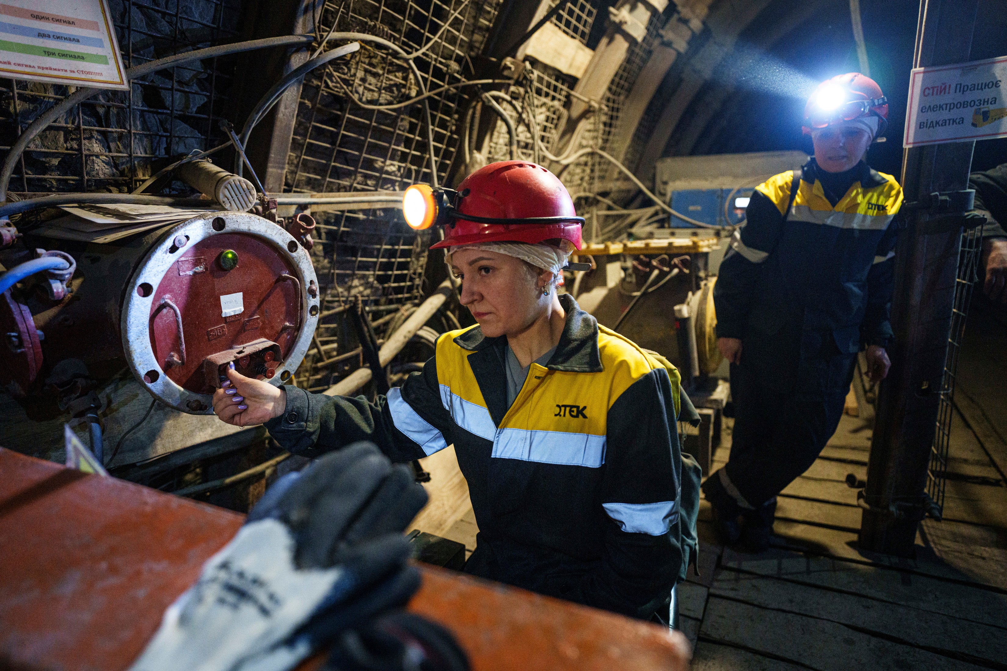 Women work in a tunnel of a coal mine in Dnipropetrovsk region, Ukraine
