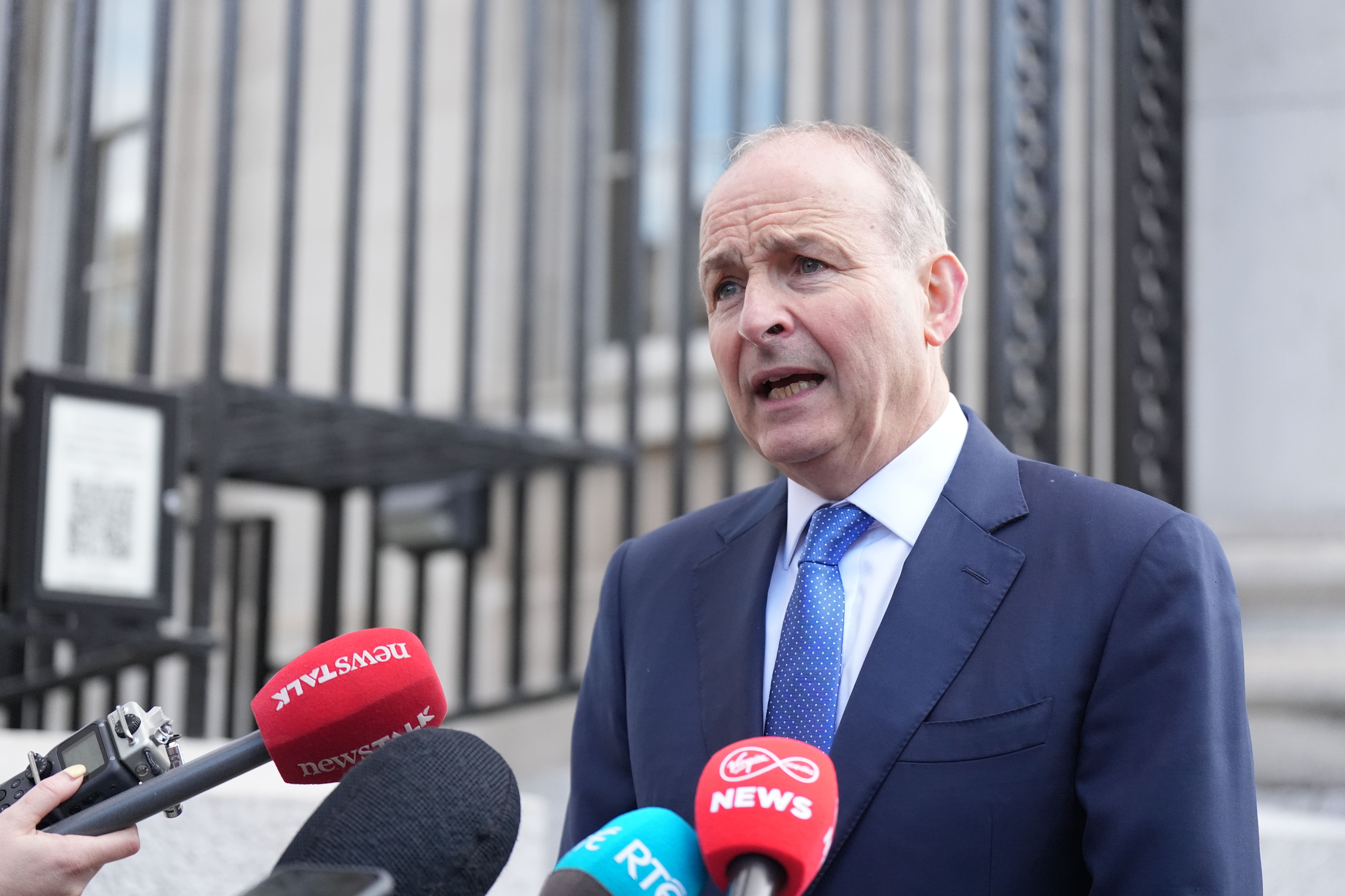 Taoiseach Micheal Martin speaks to the media as he arrives for a Cabinet meeting at Government Buildings in Dublin (Niall Carson/PA)