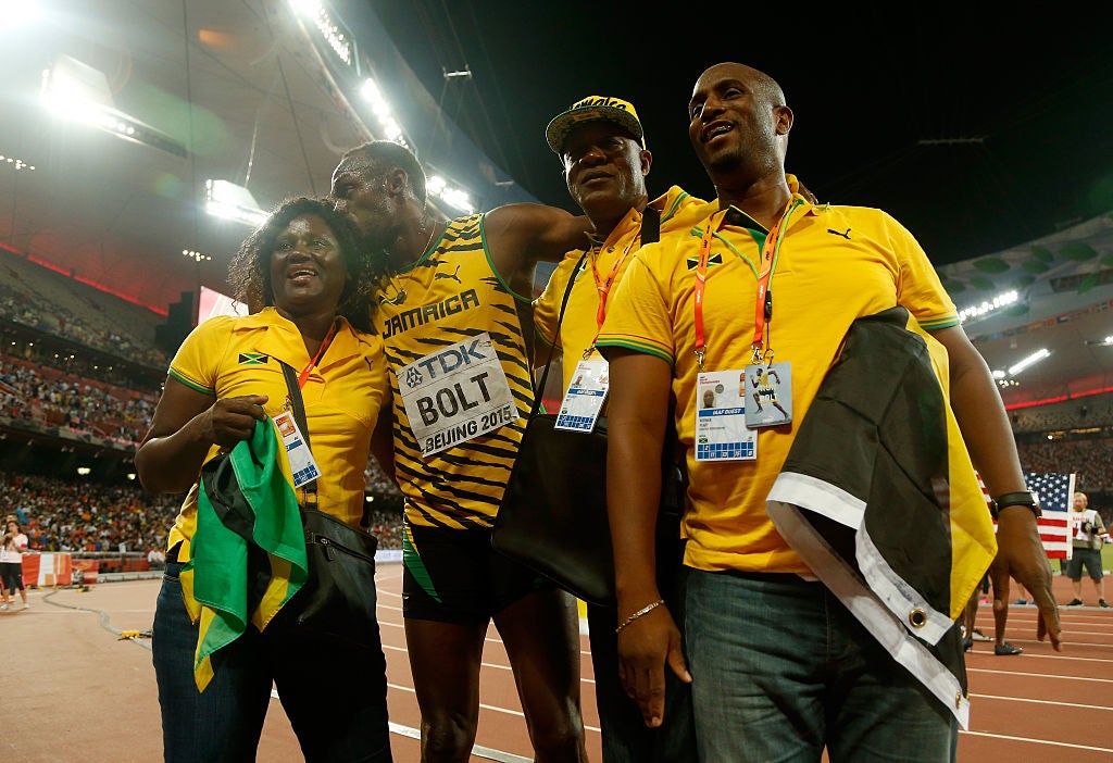 Wellesley Bolt, third from left, often attended major track meets alongside wife Jennifer (left) to cheer on his son