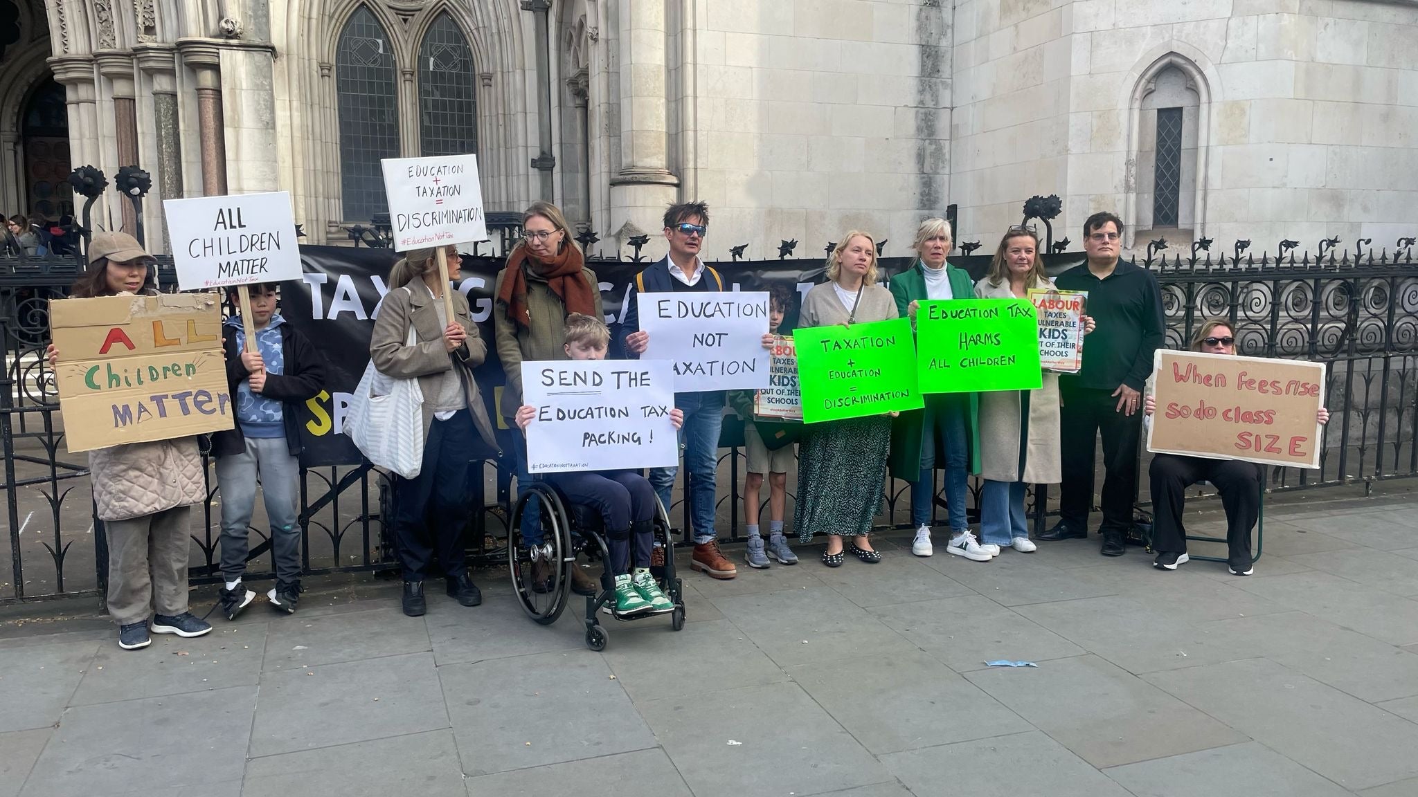 Families stood together outside the Royal Courts of Justice ahead of the case going to the High Courts