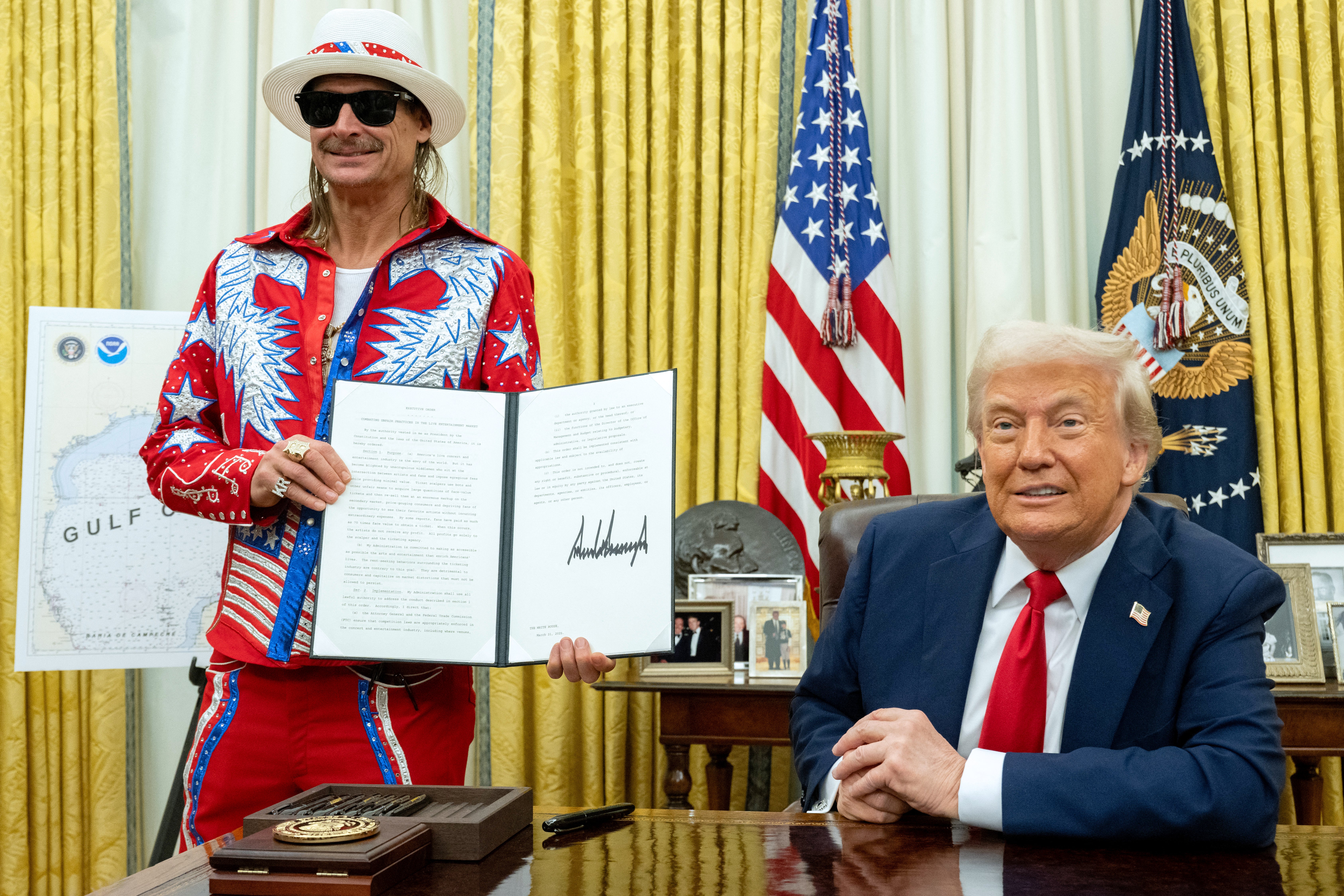 Kid Rock stunned Americans as he adorned a striking red suit while Trump signed an executive order ‘combating unfair practices in the live entertainment market’