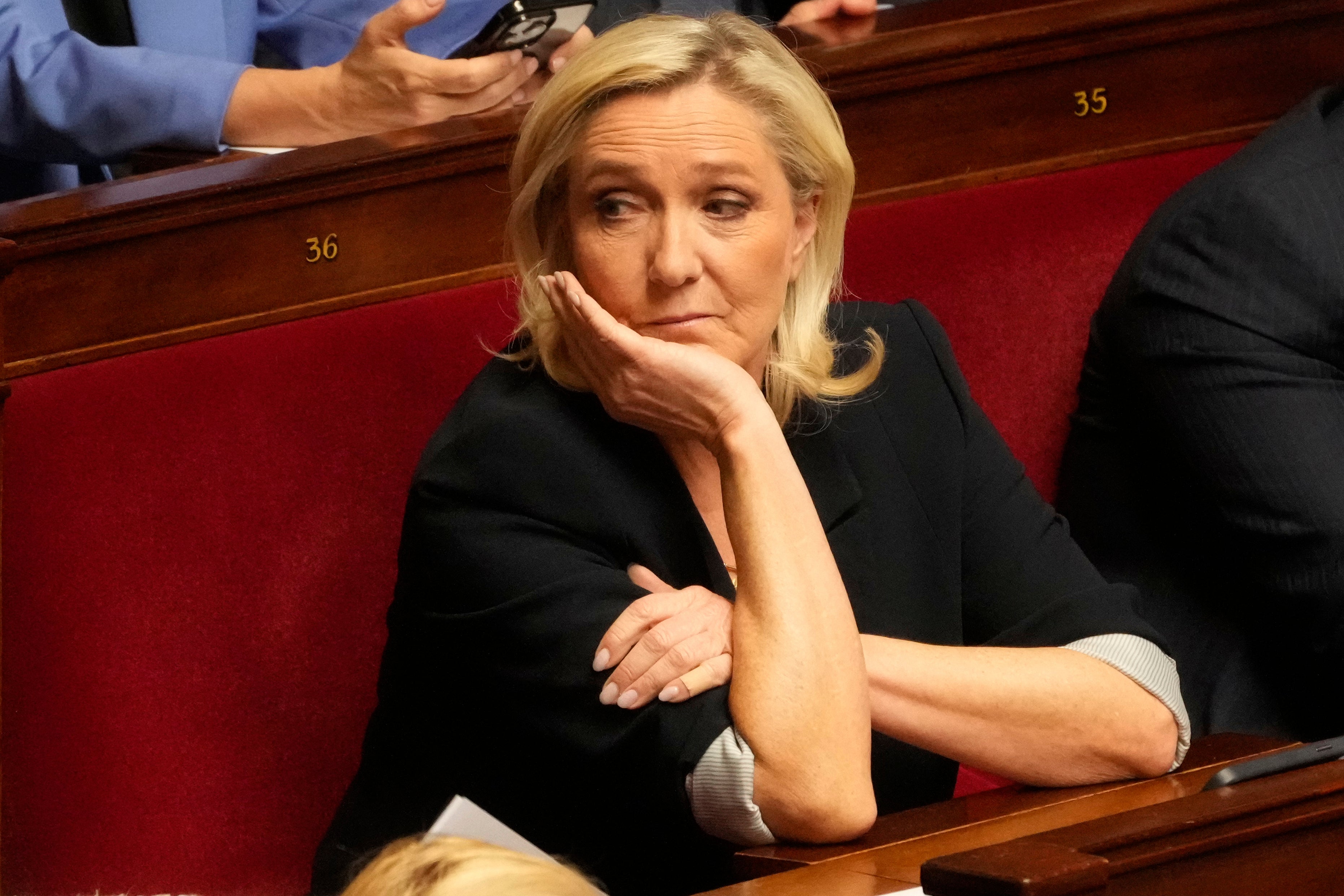 French far-right leader Marine Le Pen attends a session at the National Assembly, Tuesday, April 1, 2025 in Paris. (AP Photo/Michel Euler)