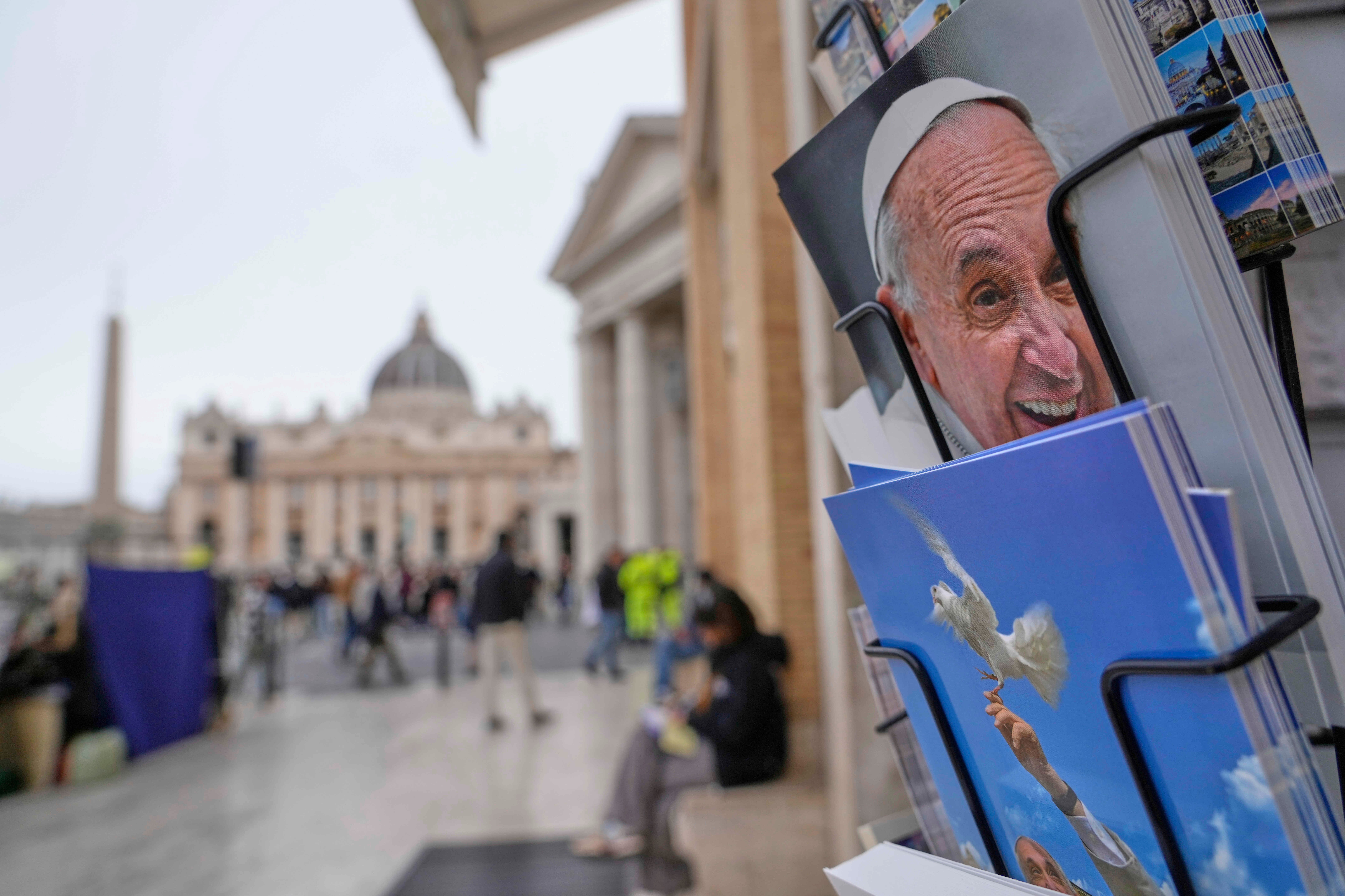 Postcards of Pope Francis are sold outside St. Peter's Square