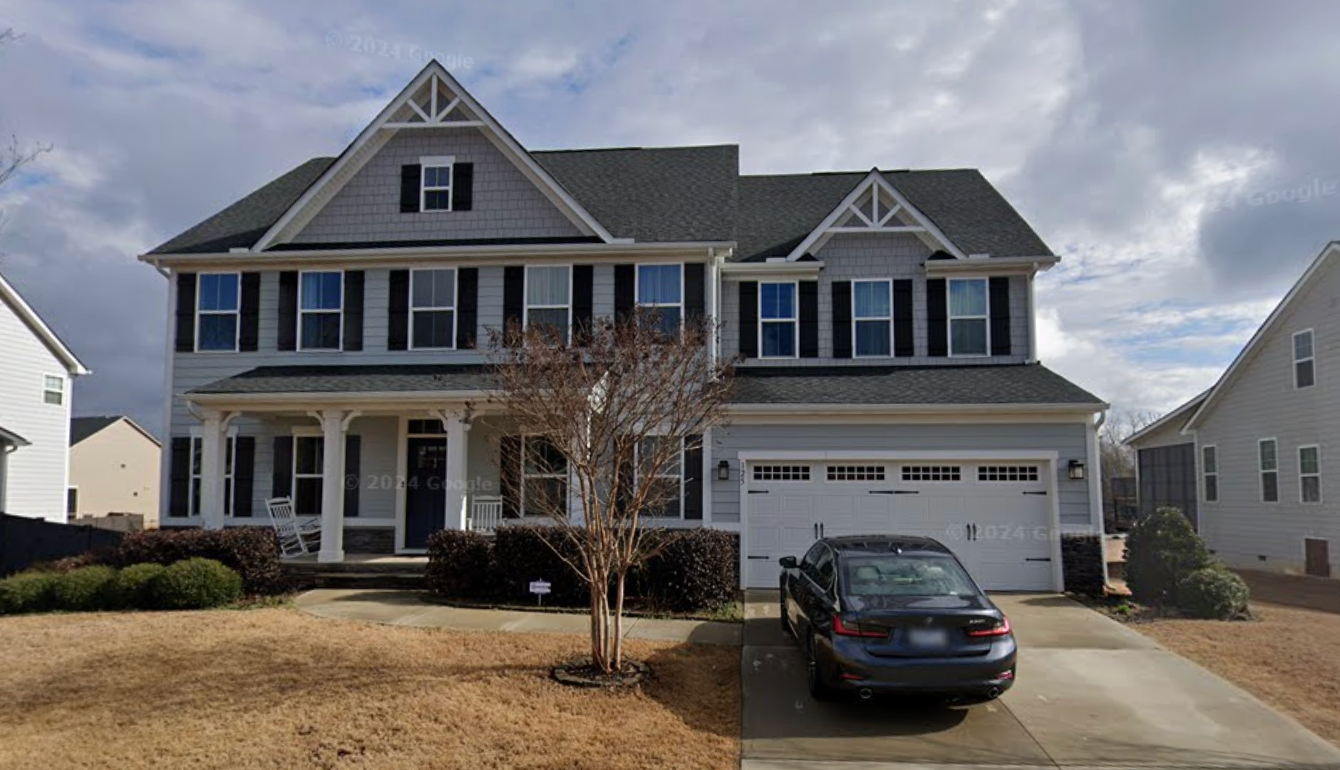 A former Bloomberg LP employee, his wife and one of his children were found dead in their Greer, South Carolina home (pictured) on Friday