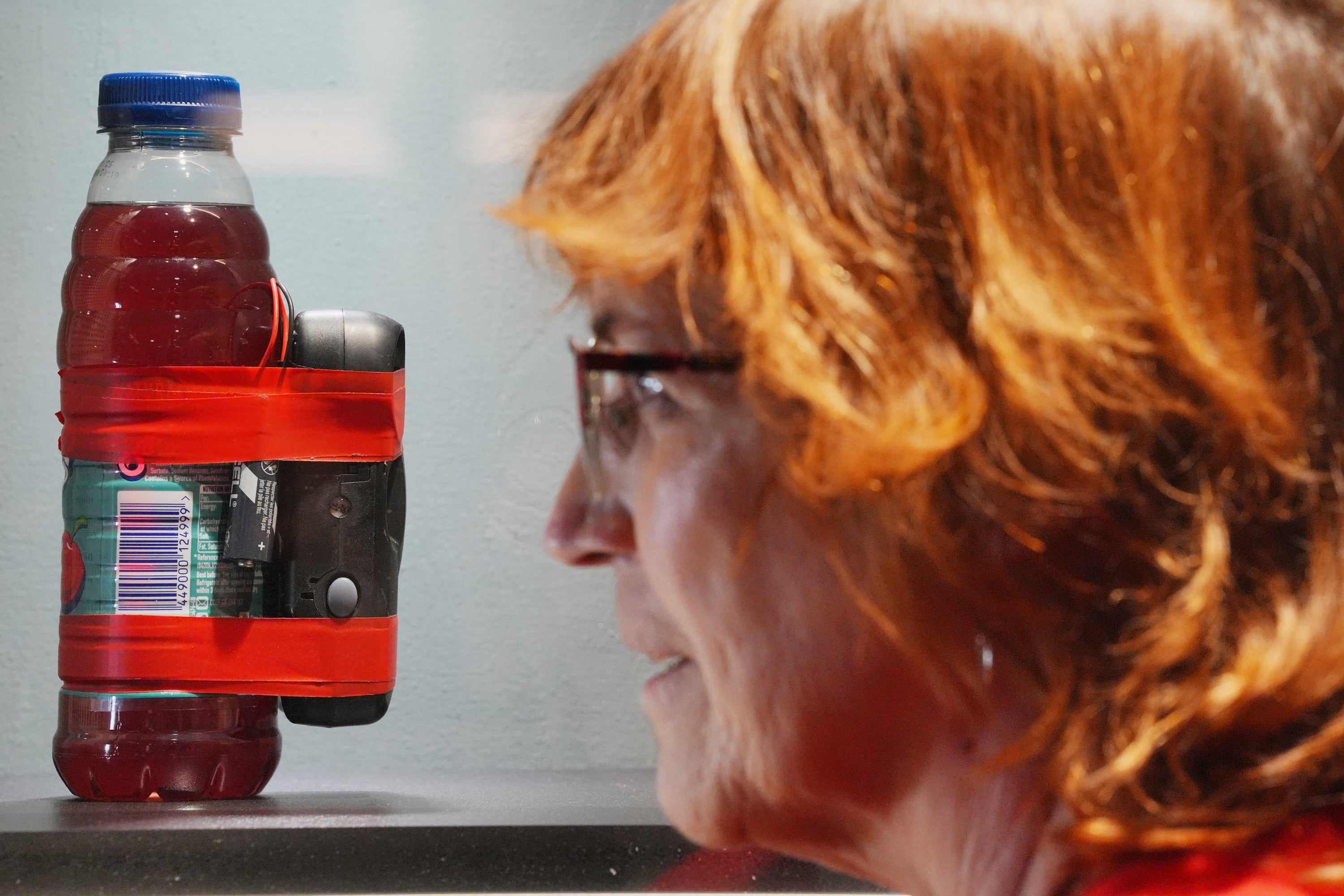 An instant camera and bottle used to make a bomb, recreated as evidence by the Bomb Data Centre