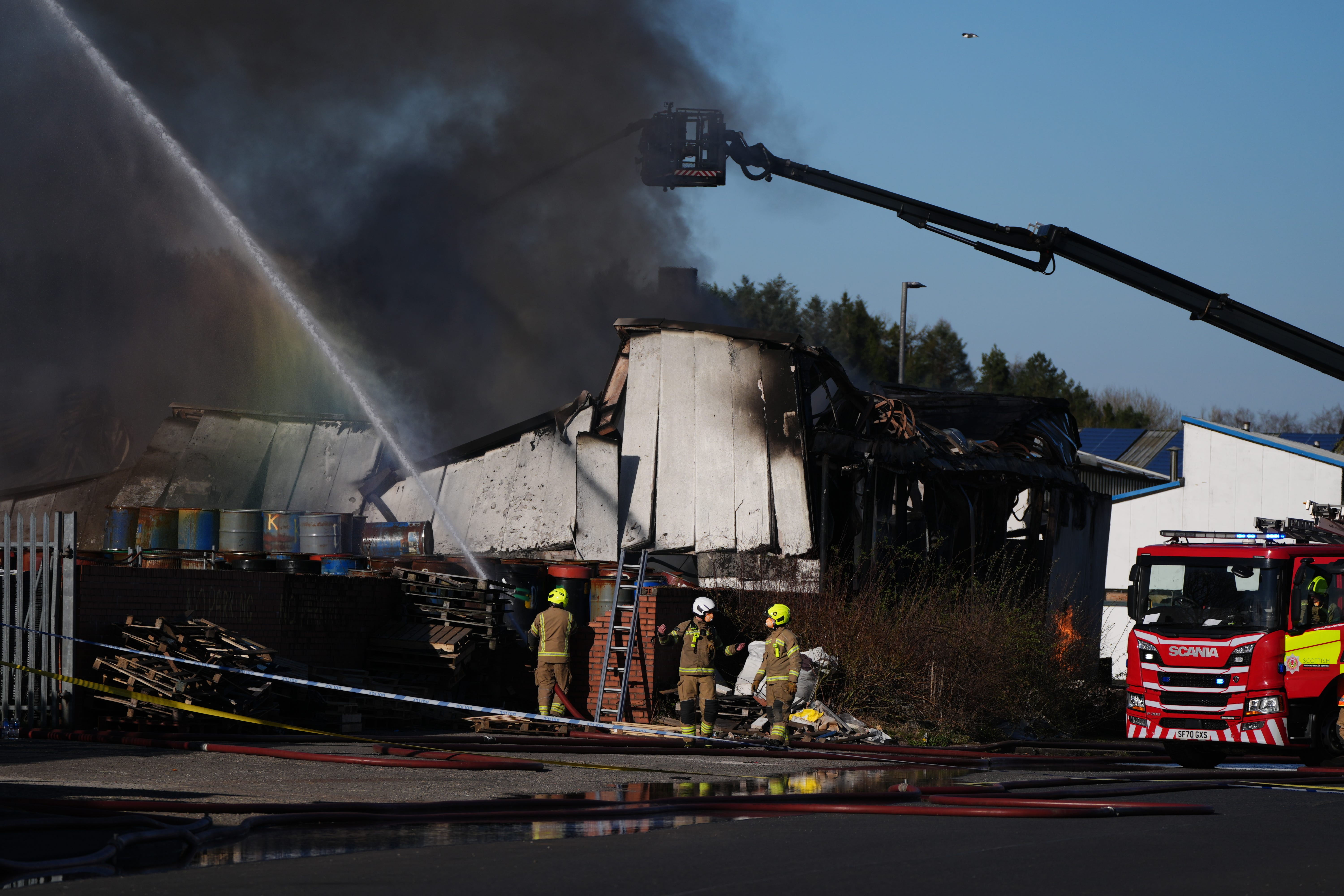 Firefighters at the scene of a fire at an industrial unit in Broomlee Road, Cumbernauld (Andrew Milligan/PA)