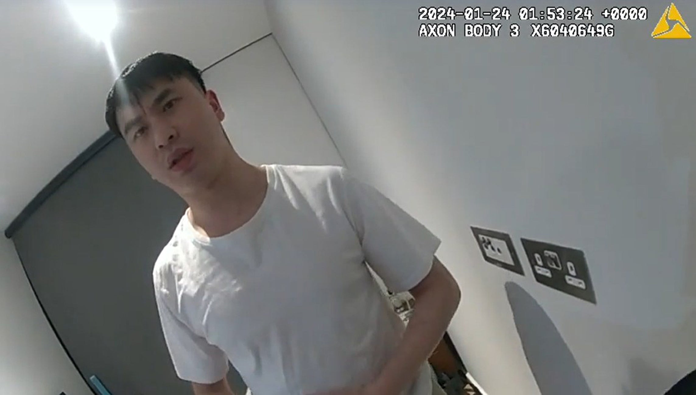 Zou during a video recording of his arrest