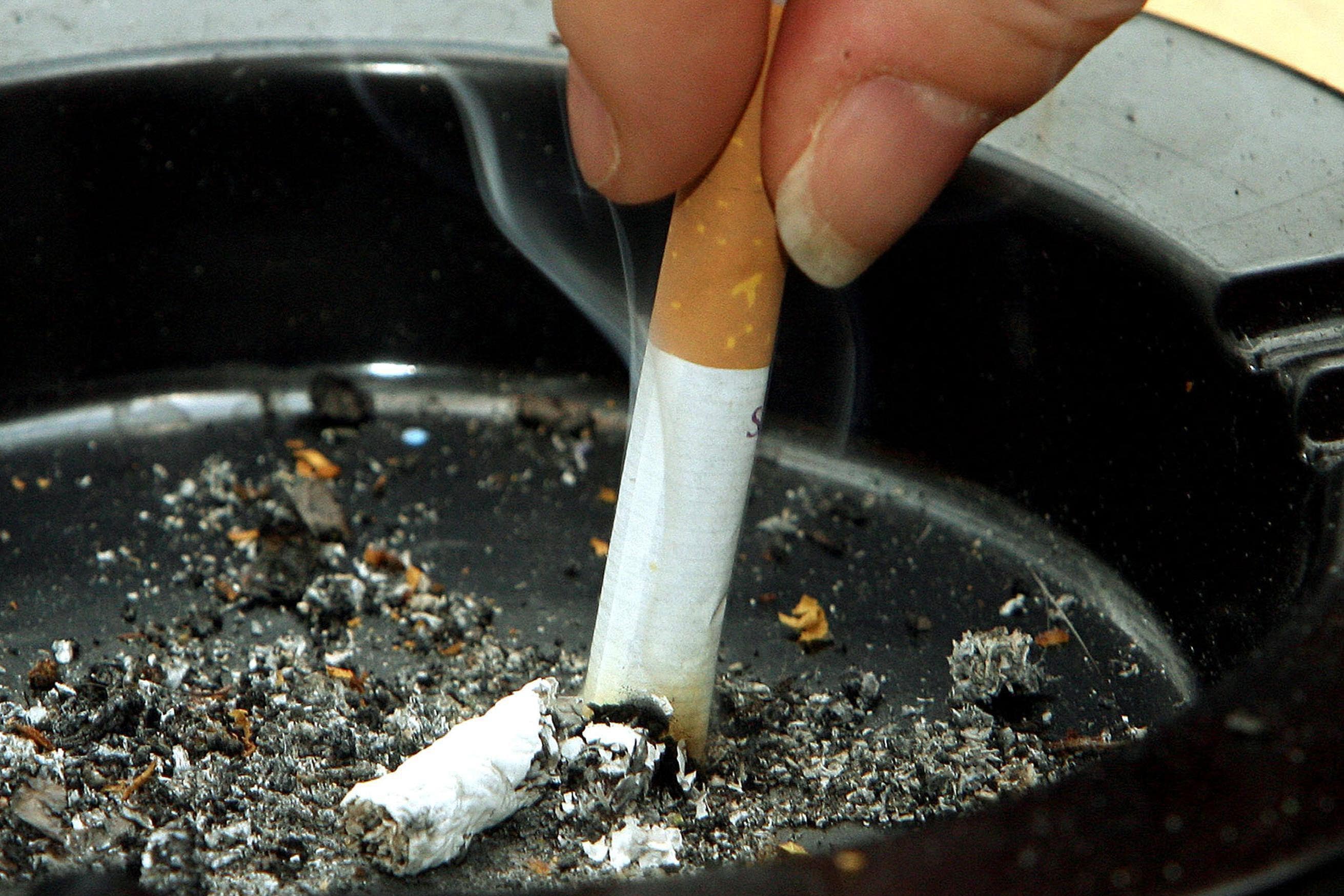 Tobacco firms should be forced to pay a ‘polluter pays’ tax, MPs have said.