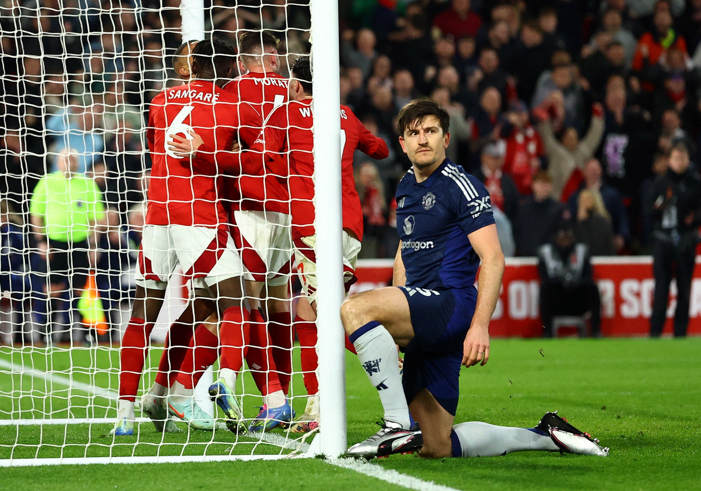 Nottingham Forest defenders celebrate keeping out Harry Maguire’s late effort