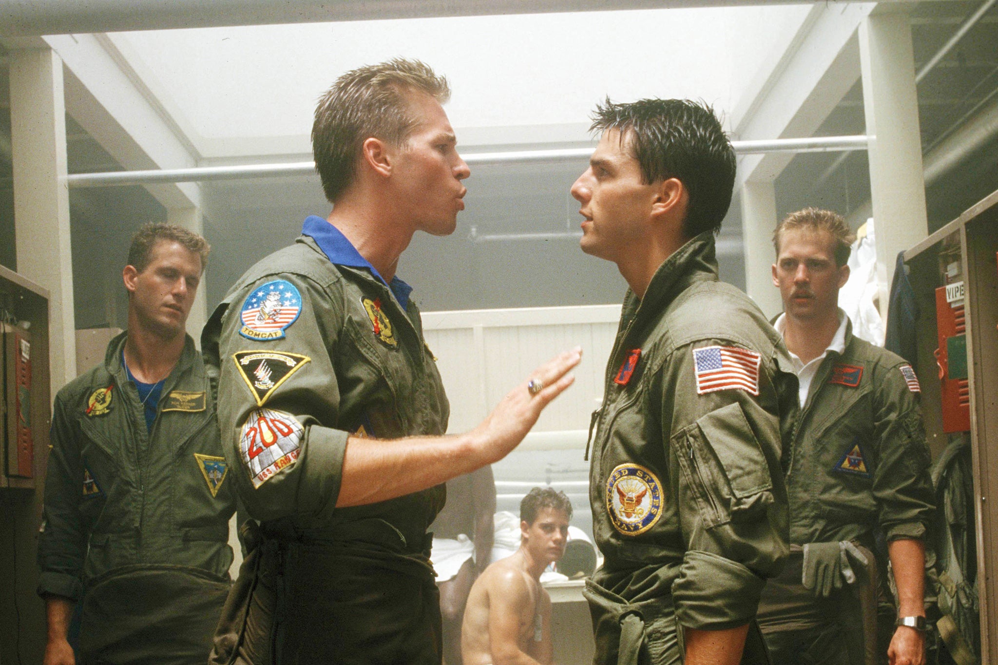 Danger zone: Flanked by Rick Rossovich and Anthony Edwards, Kilmer and Tom Cruise go at it in ‘Top Gun’