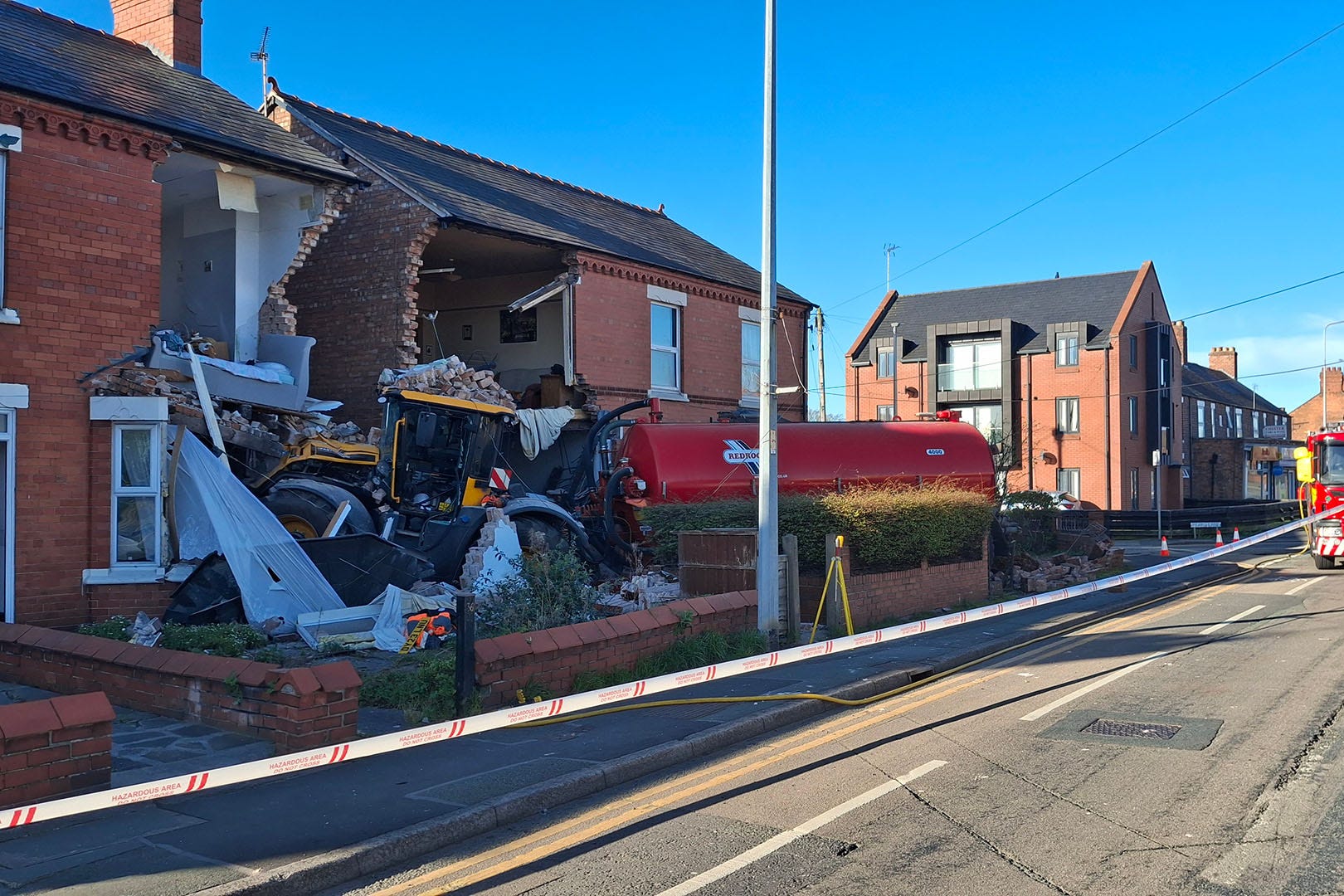 The tractor tore down parts of the homes in the collision (Cheshire Constabulary/PA)