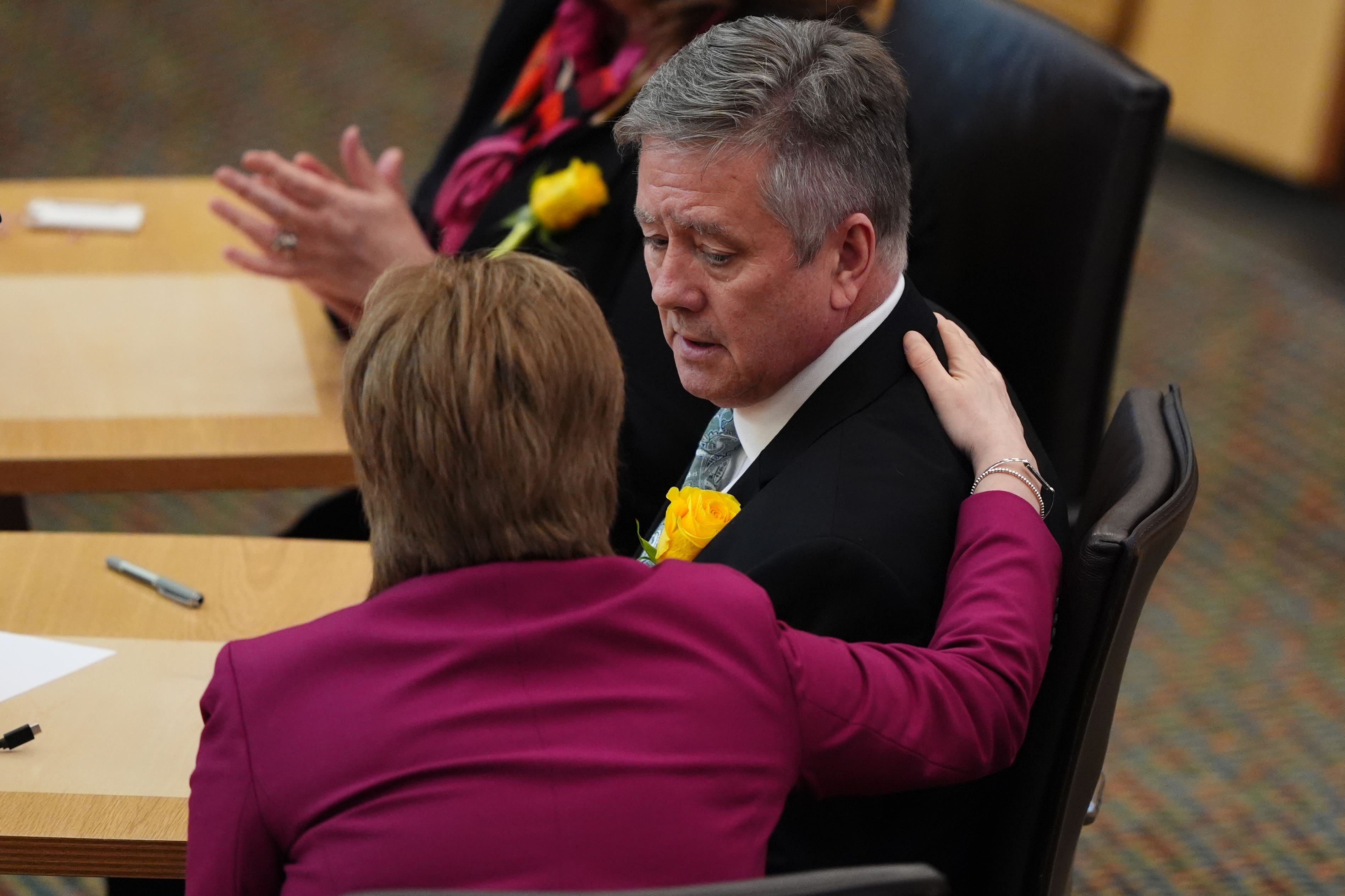 Depute SNP leader Keith Brown was consoled by Nicola Sturgeon after paying paid an emotional tribute to his partner, Christina McKelvie (Andrew Milligan/PA)