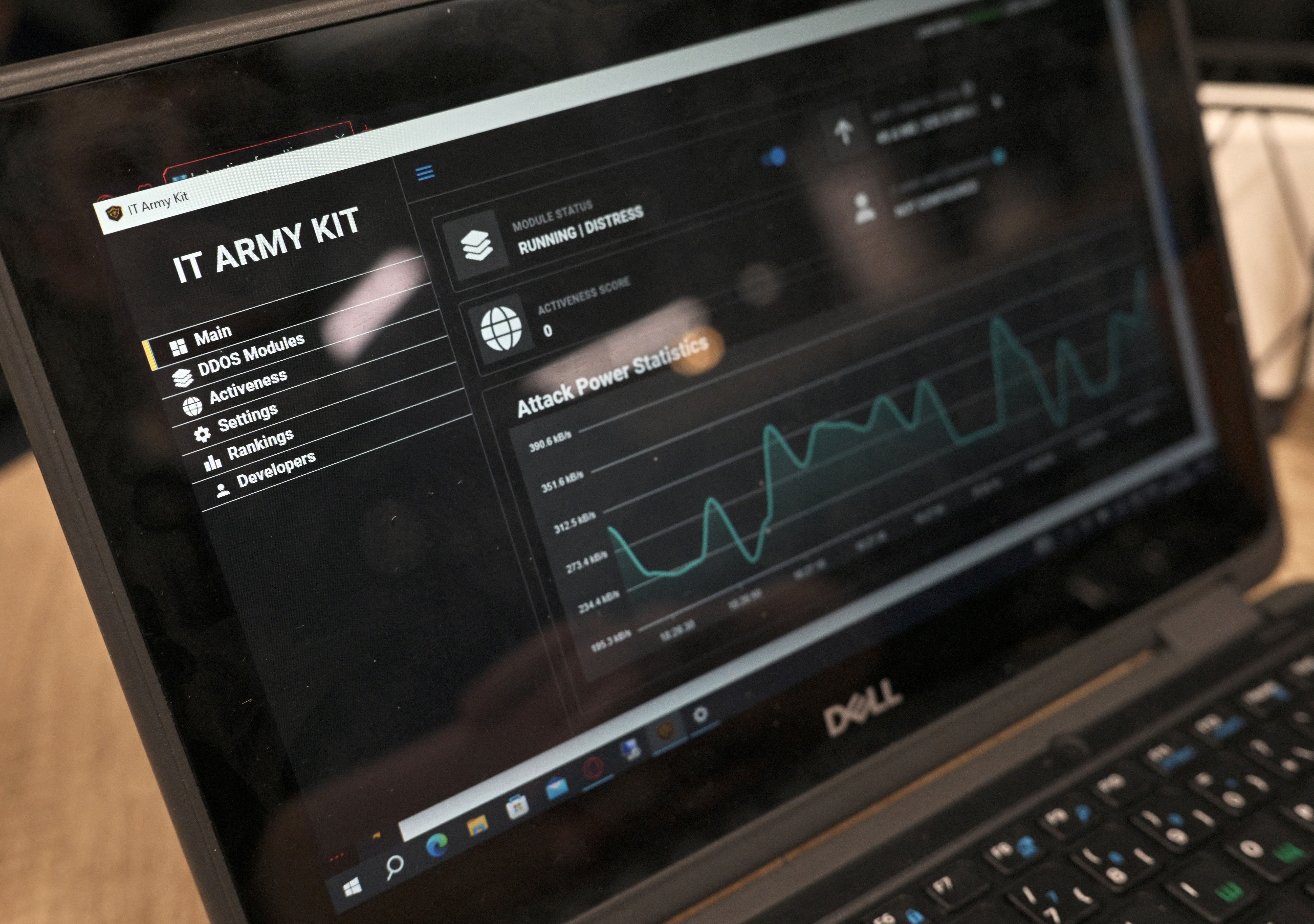 Laptop screen shows webpage of IT Army of Ukraine group of volunteer hackers