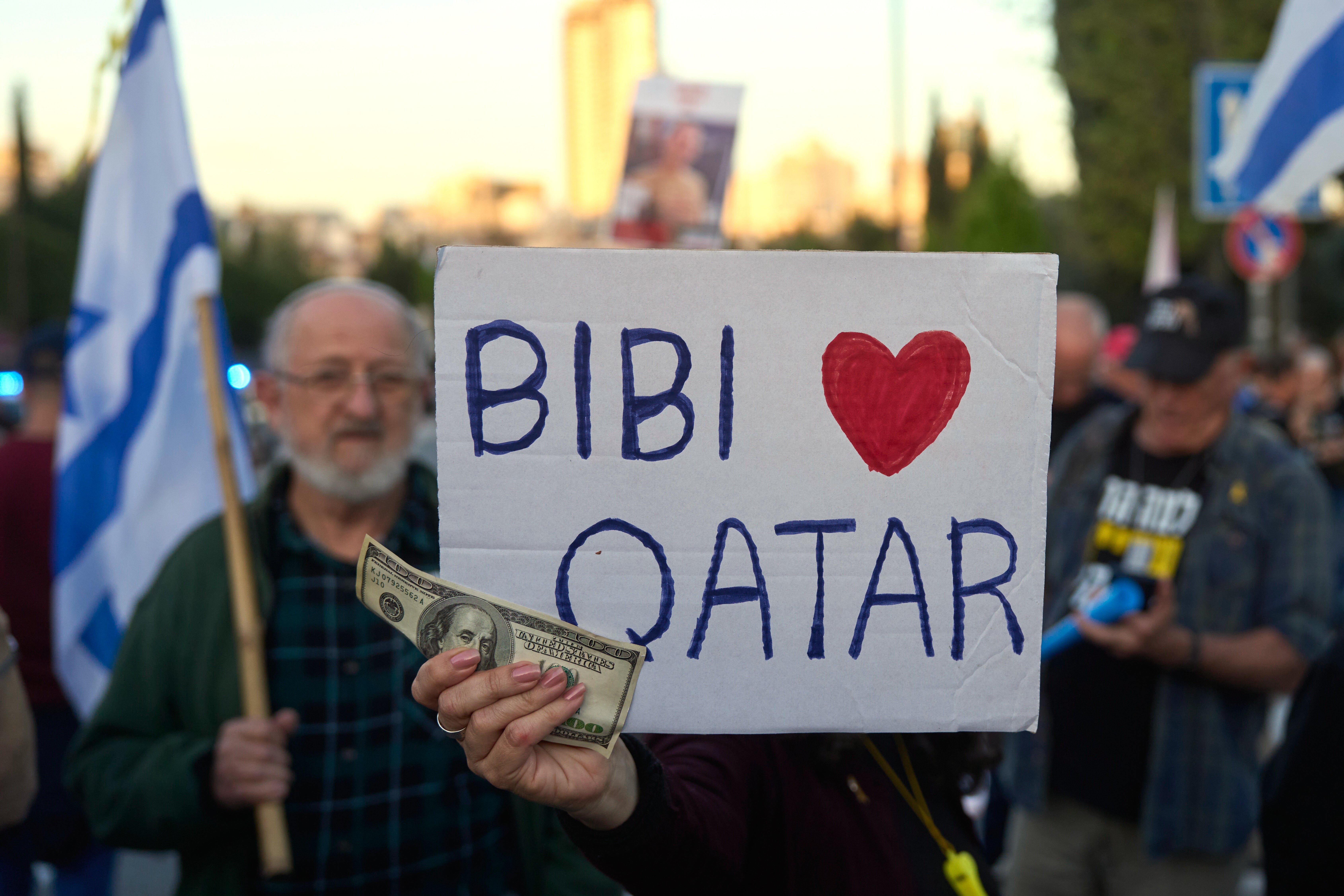 People protest against Prime Minister Benjamin Netanyahu's government outside the Knesset, Israel's parliament in Jerusalem, Monday, March 31, 2025. (AP Photo/Ohad Zwigenberg)