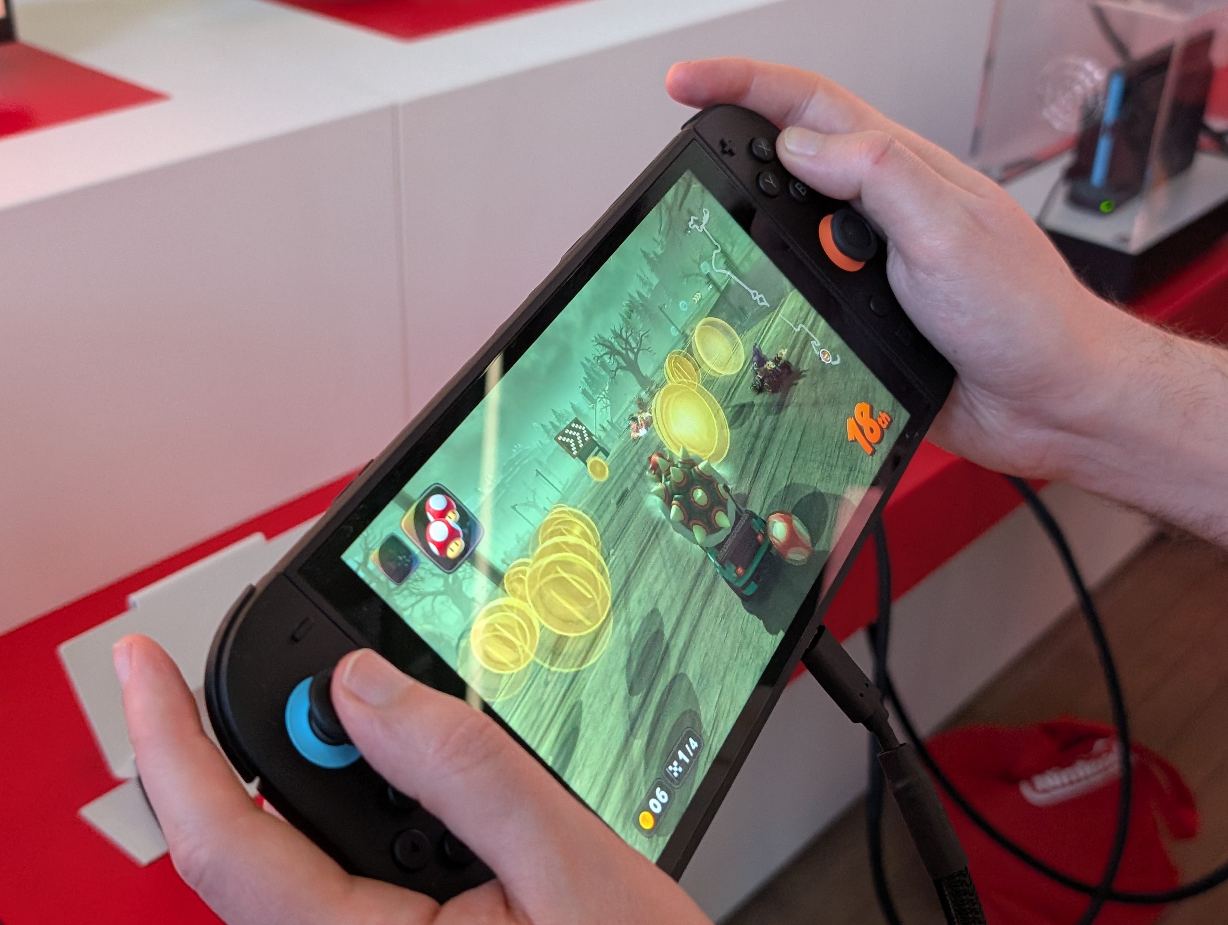 A closeup of Mario Kart World in handheld mode