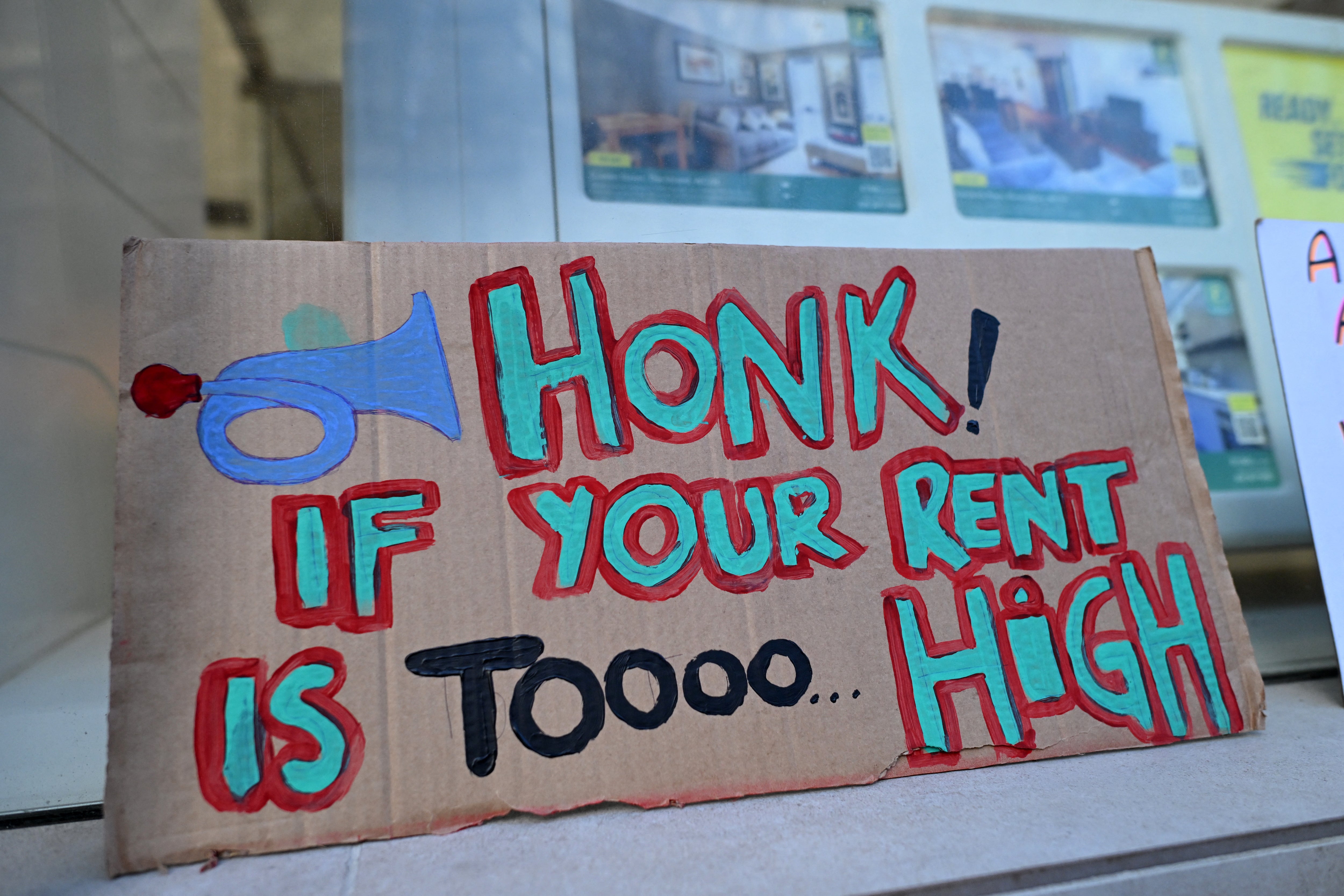 Protesters’ placards by the window of a Foxtons estate agent in central London, demanding urgent action on the city’s rising rents