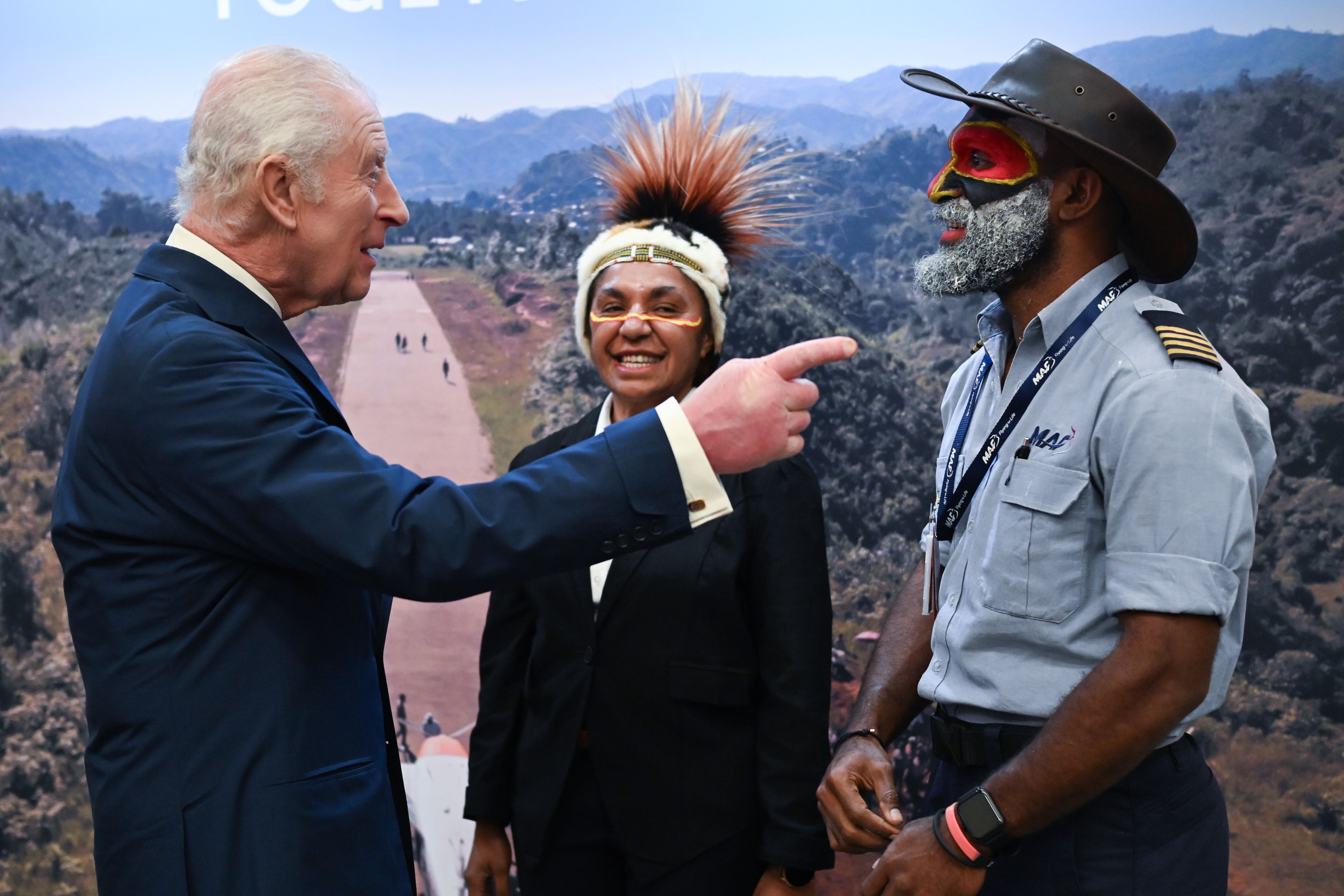 The King with pilot Joseph Tua and Serah Michael MAF Flight operations supervisor during a visit to RAF Northolt (Eddie Mulholland/Daily Telegraph/PA)