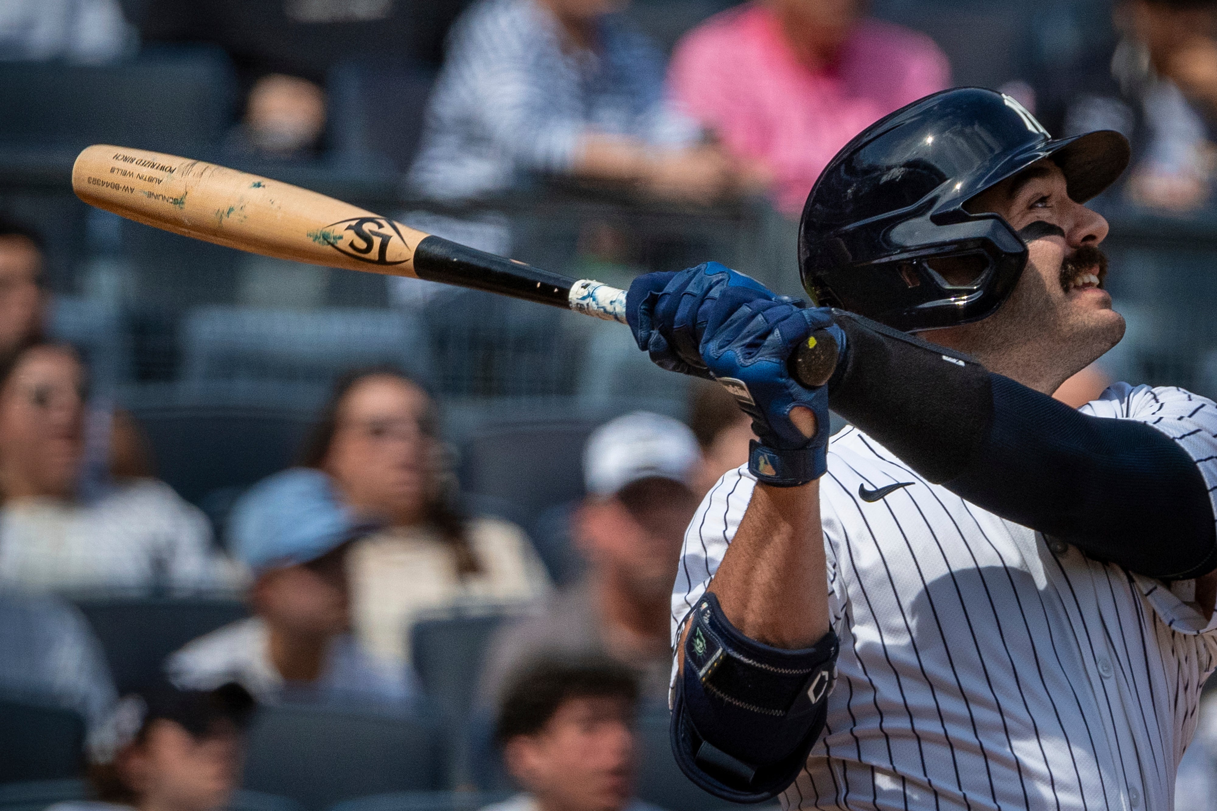 New York Yankees' Austin Wells watches his home run during the first inning of a baseball game against the Milwaukee Brewers