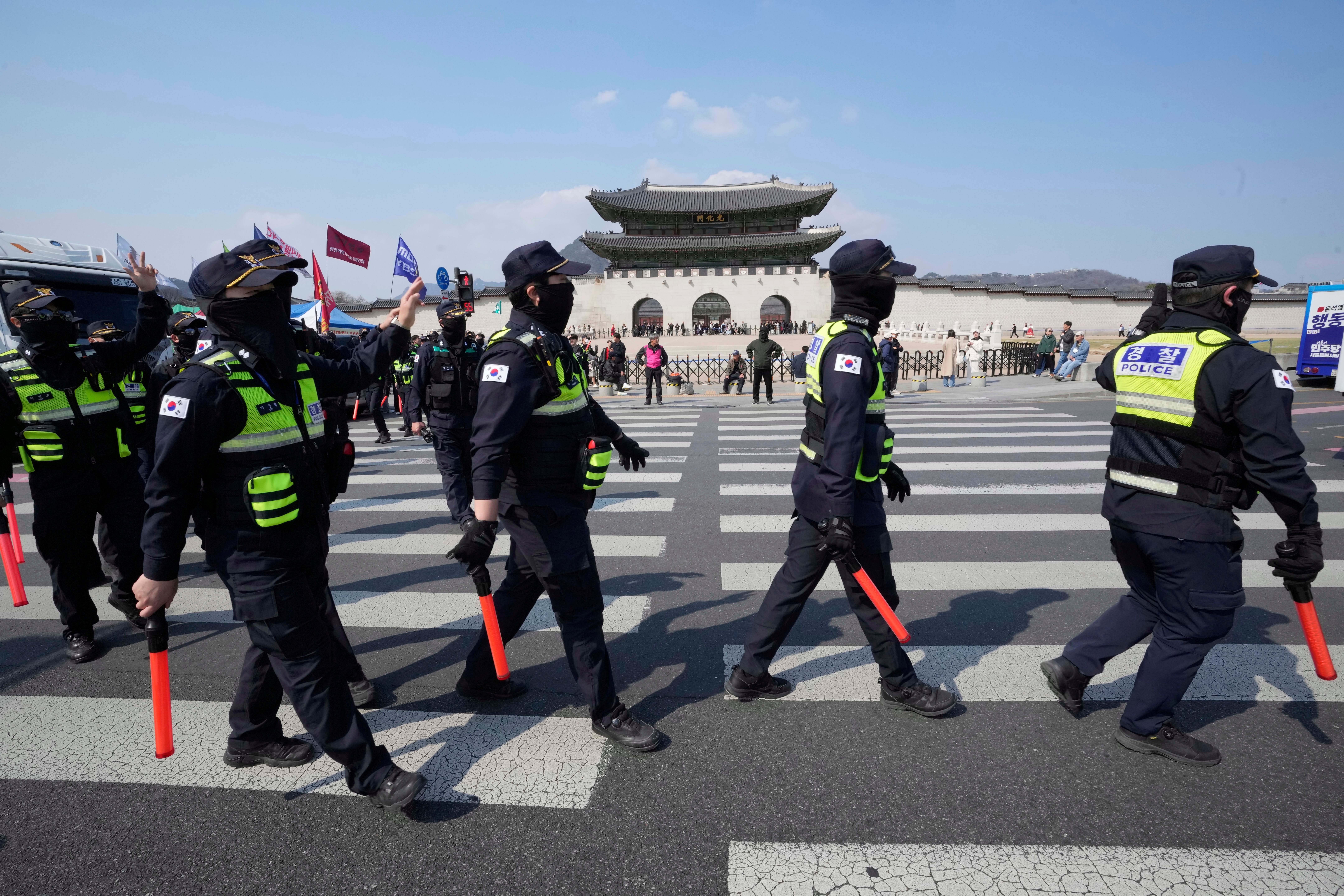 Police officers move as protesters prepare to march toward the Constitutional Court during a rally calling for impeached South Korean president Yoon Suk Yeol to step down near the Gwanghwamun, the main gate of the 14th-century Gyeongbok Palace, in Seoul, South Korea, Thursday, 3 April 2025