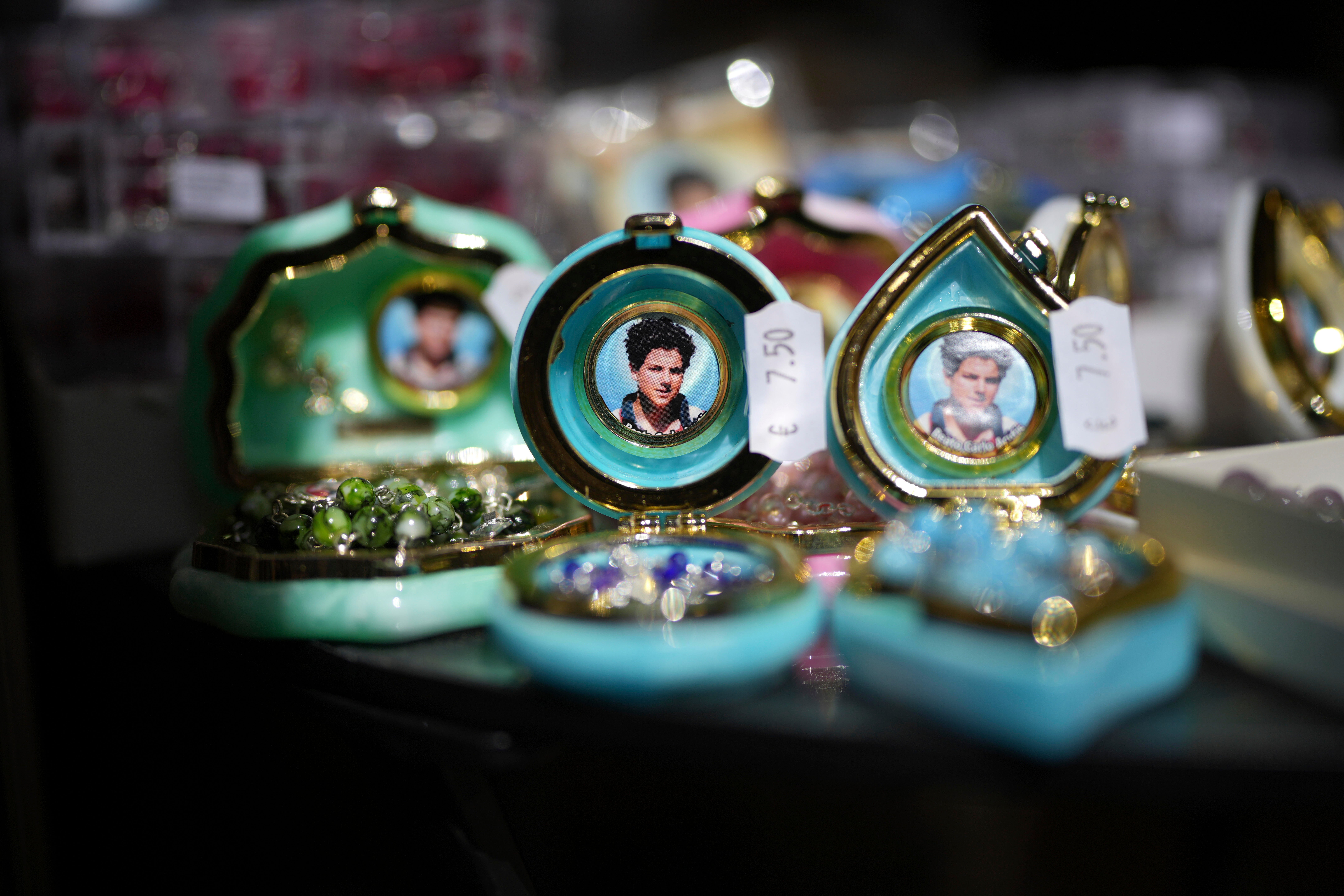 Souvenirs of millennial saint Carlo Acutis are displayed in a shop in Assisi, Italy