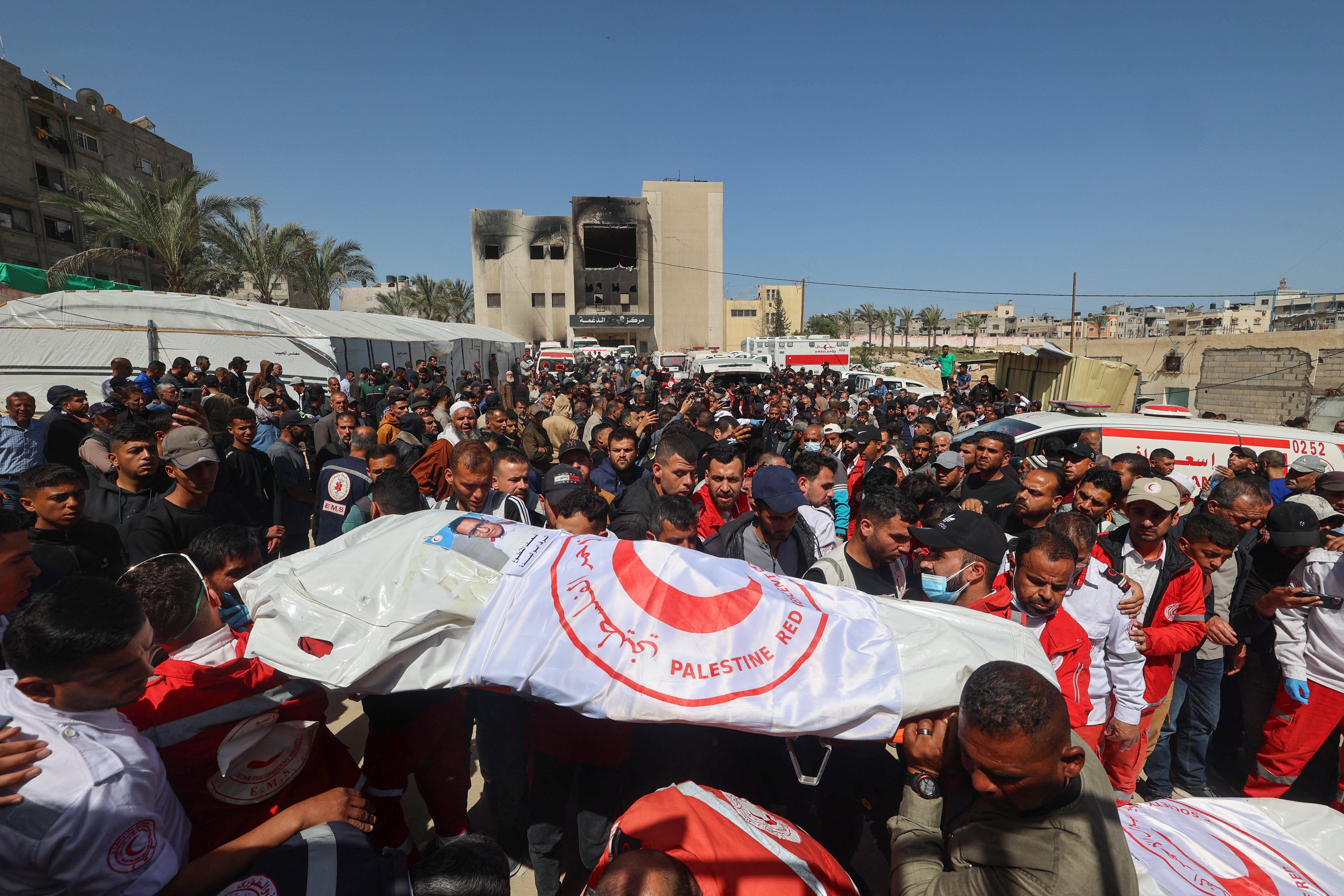 Bodies of eight medics from the Red Crescent, six members of Gaza's civil defence agency and one employee of a UN agency were retrieved after being killed by the IDF
