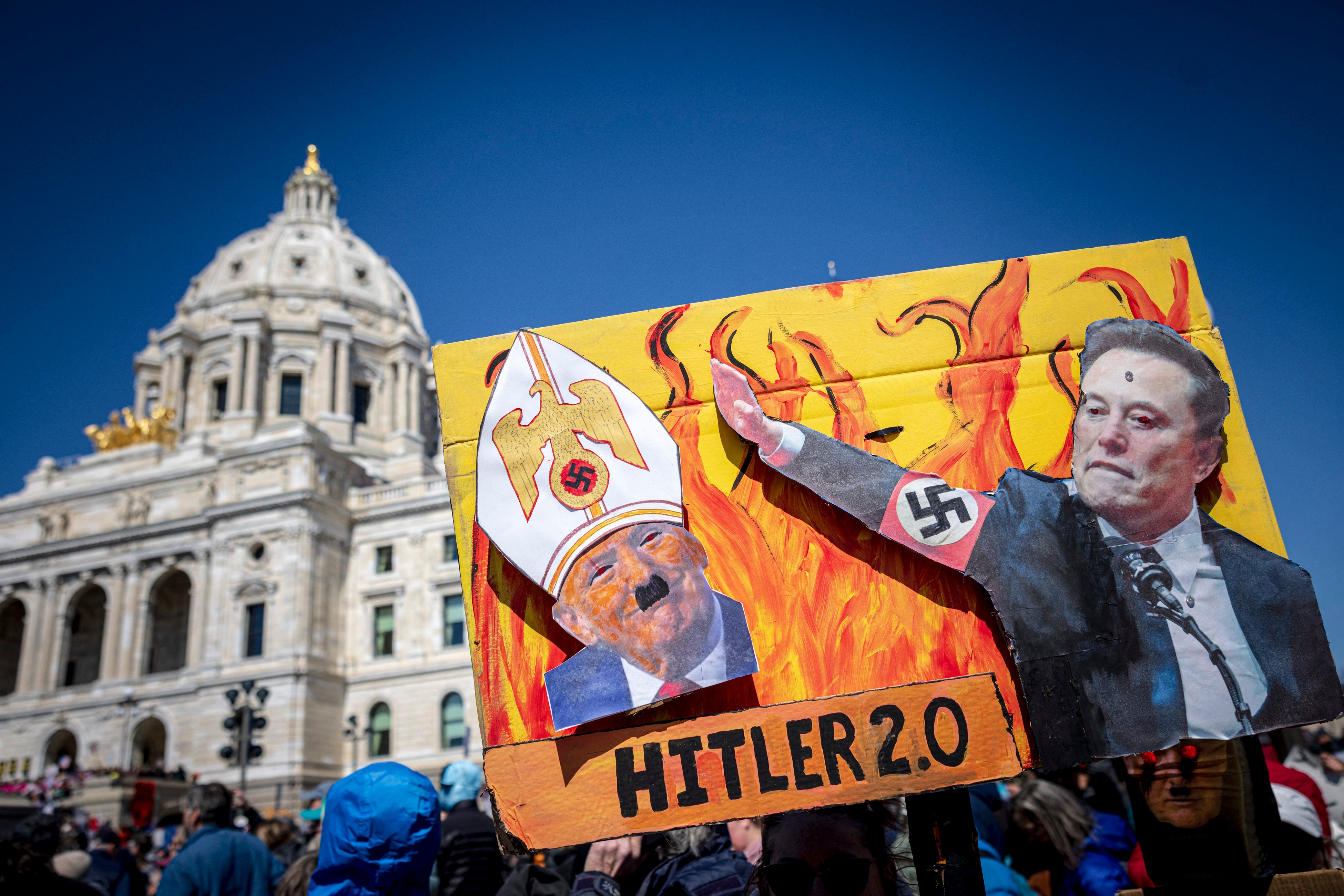 Protesters in St. Paul, Minnesota held up a sign comparing Trump and Musk to Nazis, including a photo of the world’s richest person doing the ‘Nazi salute’ at an inauguration event in January