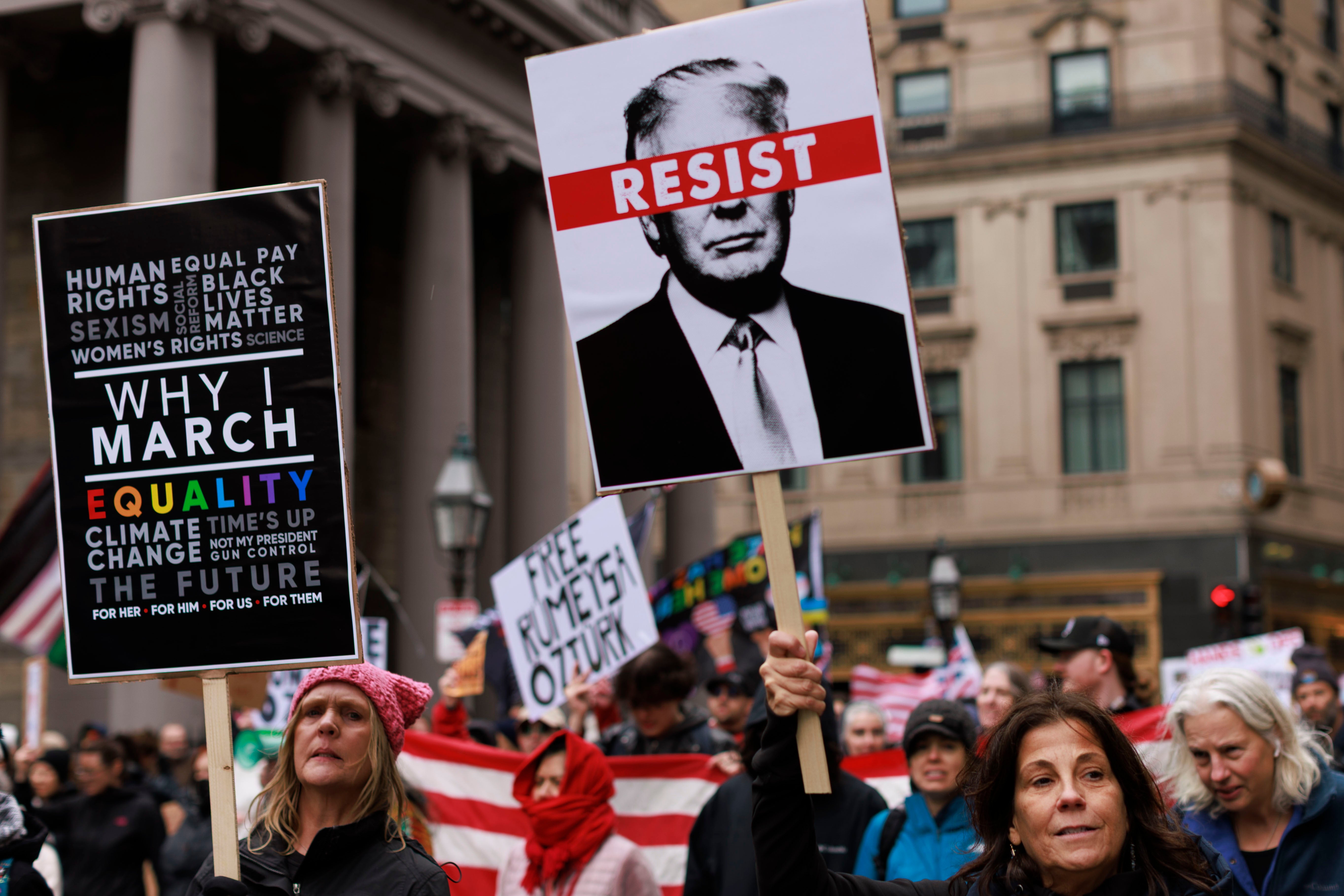 Protesters in Boston held up signs calling to free detained Tufts University PhD student Rumeysa Ozturk, a 30-year-old Turkish national